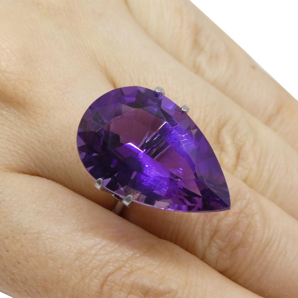 Description:

Gem Type: Amethyst
Number of Stones: 1
Weight: 22.11 cts
Measurements: 25.62 x 16.36 x 11.13 mm
Shape: Pear
Cutting Style:
Cutting Style Crown: Brilliant
Cutting Style Pavilion:
Transparency: Transparent
Clarity: Very Very Slightly