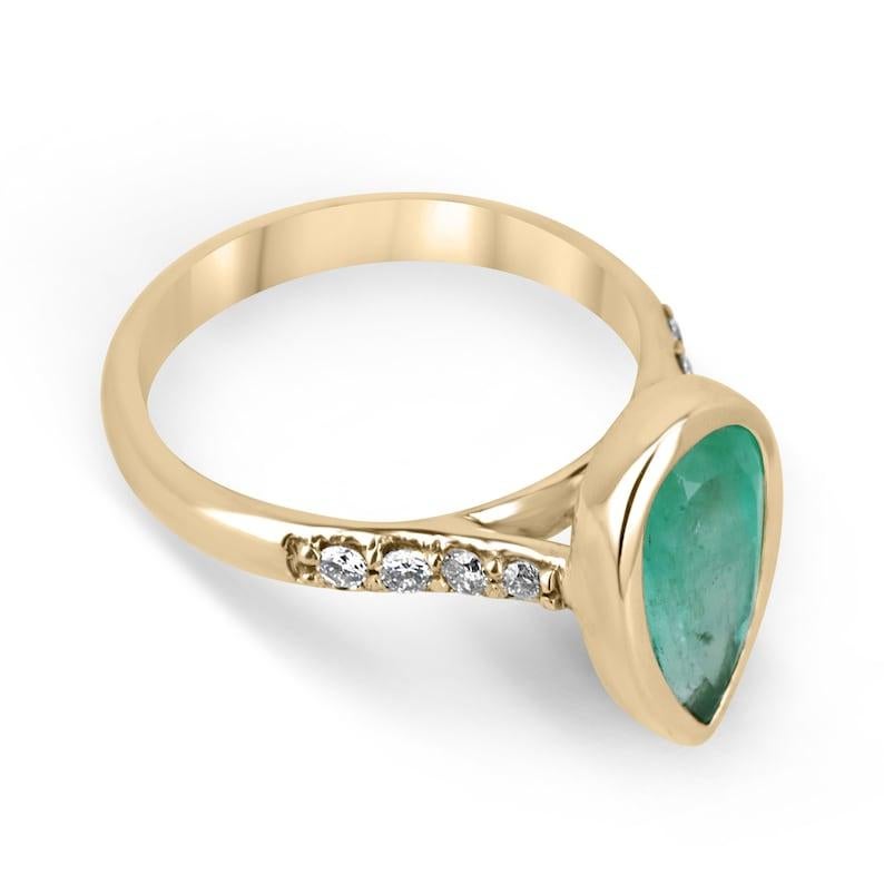 Capture the essence of everlasting love with this captivating emerald and diamond engagement ring. A mesmerizing 1.97 carat pear-cut emerald takes center stage, showcasing its semi-transparent clarity, medium green color, and brilliant luster.