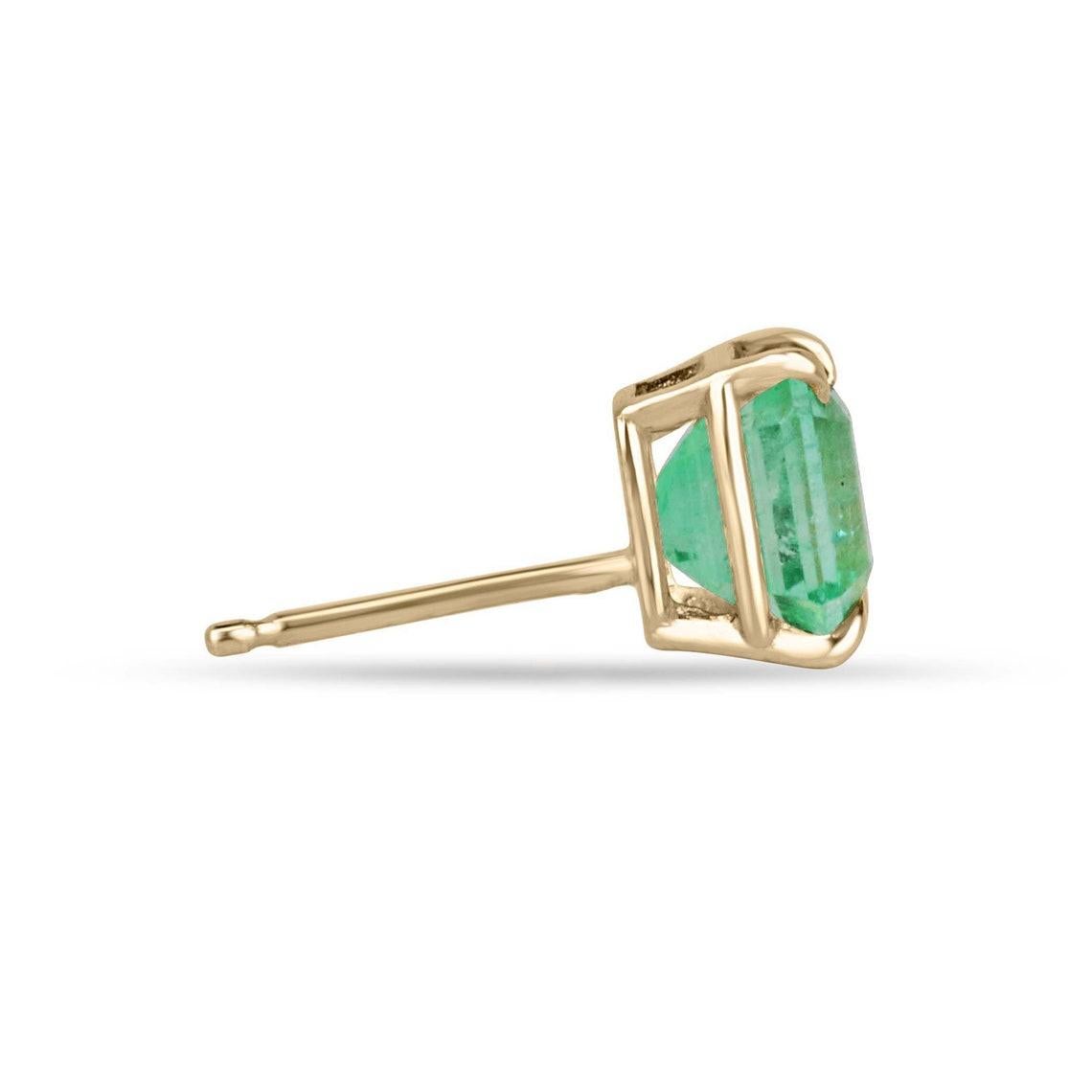Experience the allure of Colombian beauty with our exquisite emerald stud earrings, featuring two mesmerizing emerald-cut emeralds. With a rich, vivid green hue, remarkable clarity, and superb luster, these gems are elegantly showcased in a