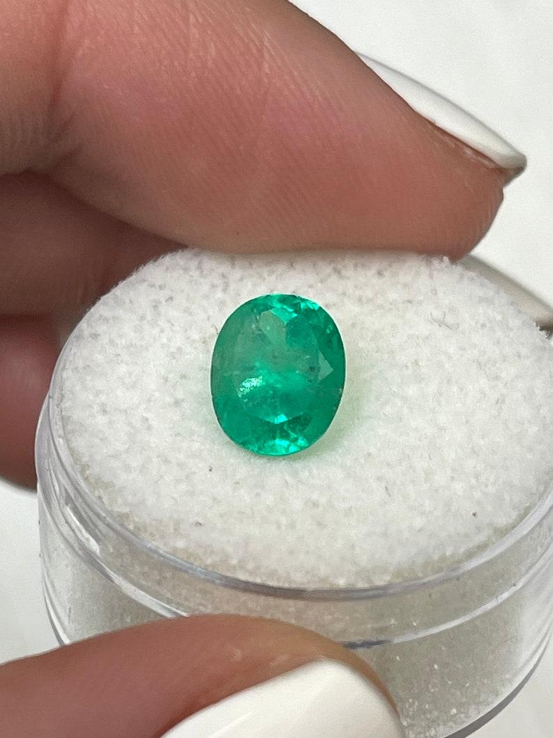 Stone: Emerald
Weight: 2.22-carats
Shape: Oval Cut
Clarity: Semi-Transparent
Luster: Very Good
Color: Medium Green
Measurements: 9.14mm x 7.52mm x 5.92mm
Geographic Origin: Colombia
Treatment: Natural, Oiling

Comments: Due to their growth