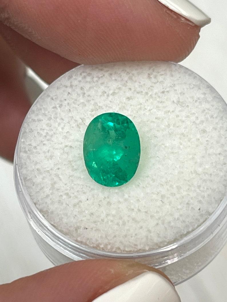 Women's or Men's 2.22 Carat 9x8 Glowy Green Colombian Emerald - Oval Cut May Birthstone Gem For Sale