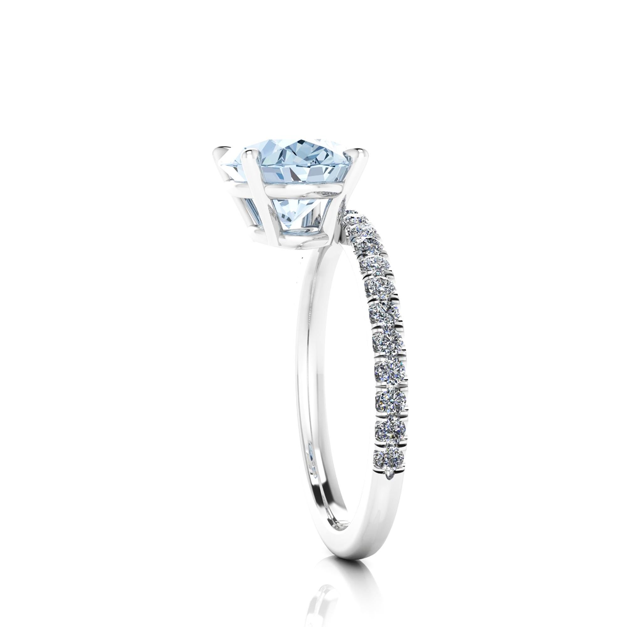 A  2.22 carat horizontal, set east to west Oval blue Aquamarine, set on a Platinum 950 ring, designed and hand made in New York 
adorned by white round diamonds, hand set, for an approximate 0.60 carats, for a maximum shine and sparkle.

This ring's