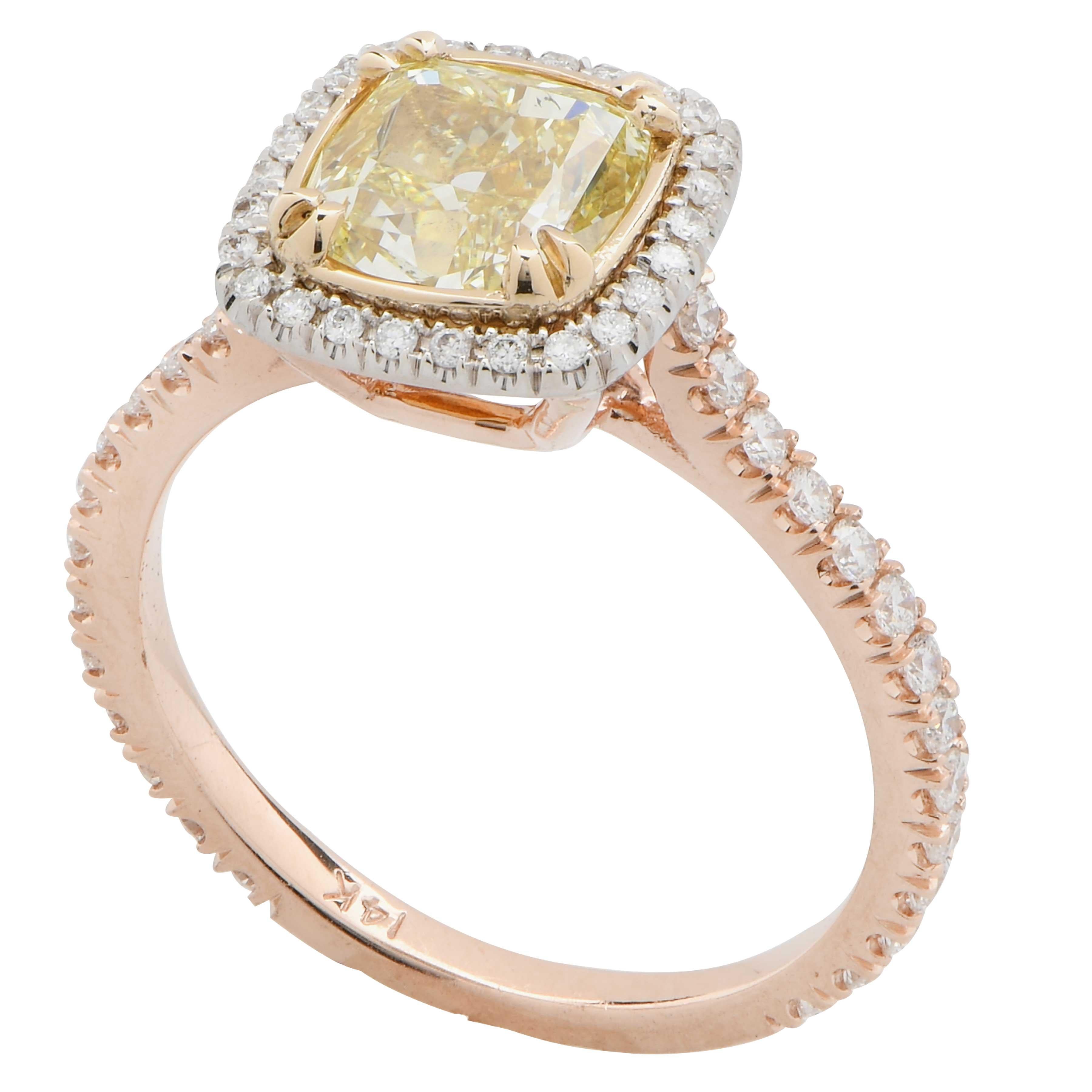 2.22 Carat Cushion Cut Diamond set in 14 Karat Yellow and White Gold Mounting with 54 round brilliant cut diamonds with an estimated total weight of .40 carats.
Ring Size is 7 (can be sized)
Metal Weight is 3.7 Grams
