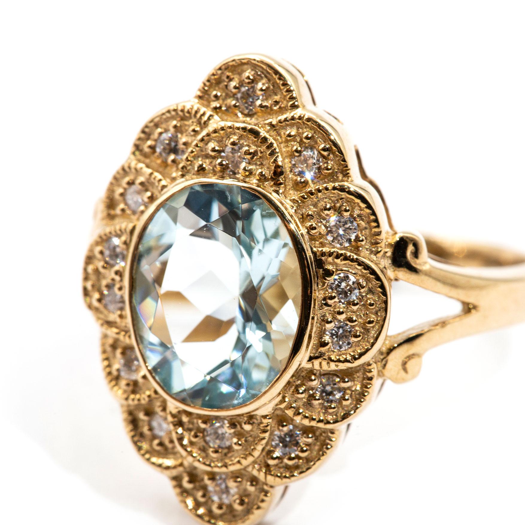 Oval Cut 2.22 Carat Oval Aquamarine and Diamond Halo Cluster 9 Carat Yellow Gold Ring