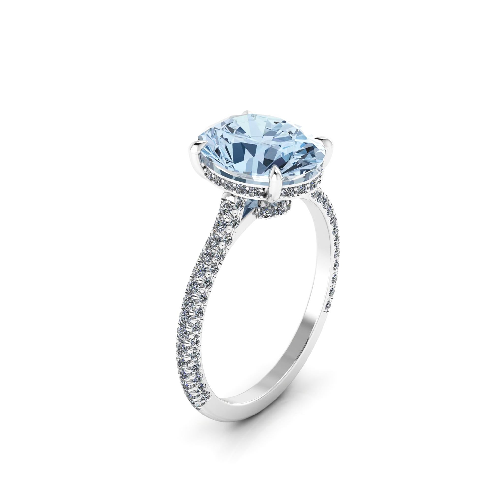 A  2.5 carat Oval light blue Aquamarine, hand cut, set on a Platinum 950 ring, designed and hand made in New York 
adorned by white round diamonds, hand set, for an approximate 0.50 carats, for a maximum shine and sparkle.

This ring's size is 5