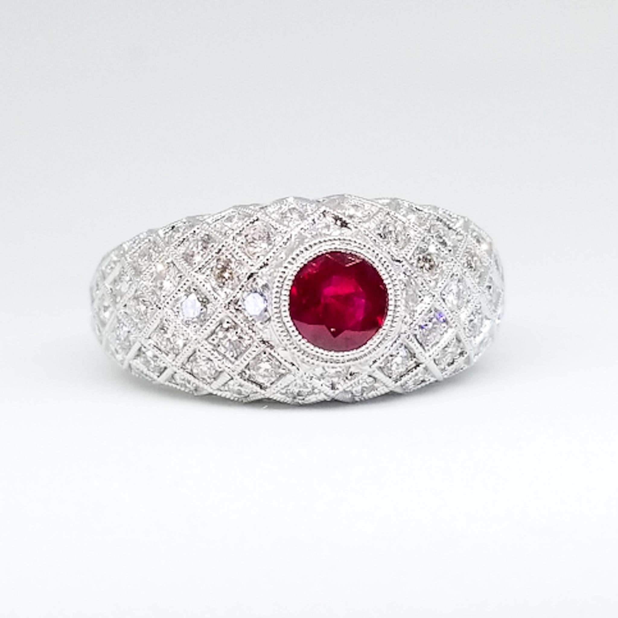 An Art Deco Inspired Engagement, Anniversary or Right Hand Ring is set with a 0.72 Carat Round Ruby with Rich Burma Red Color Saturation. The Unheated, Gem Quality stone is set low in the Band Style Ring in a protective bezel of Hand Millegrained