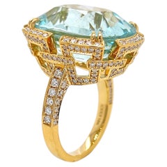 Anello in oro giallo con diamante rotondo e acquamarina da 22.22 carati
