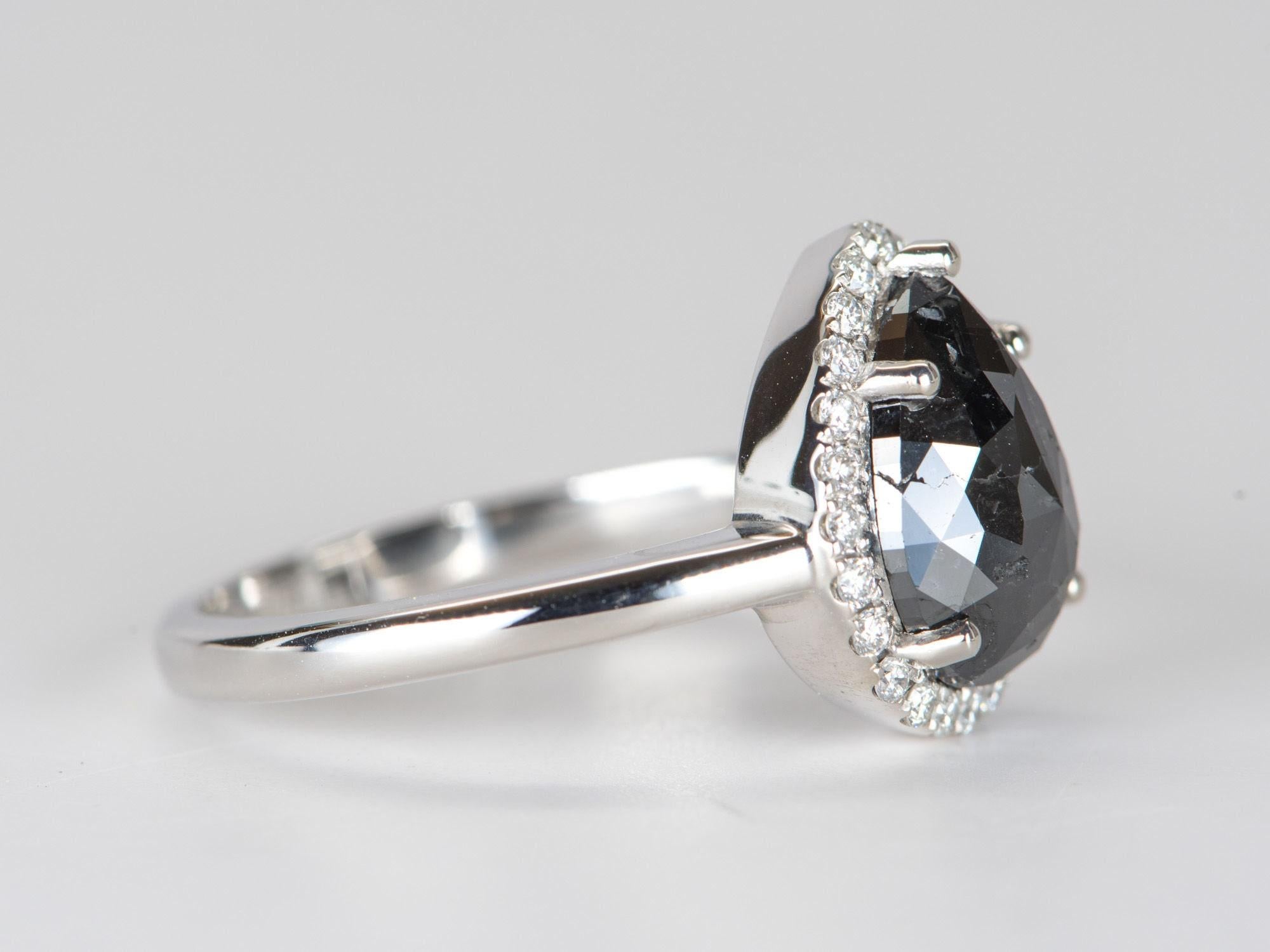 ♥ 2.22ct Black Diamond with Diamond Halo 14K White Gold Engagement Ring
♥ Solid 14k white gold ring set with a beautiful pear-shaped diamond
♥ Gorgeous black color!
♥ The item measures 13.05 mm in length, 10.8 mm in width, and stands 5.8 mm from the