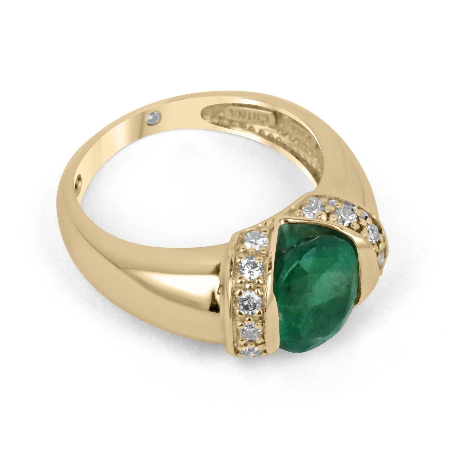 Displayed is a natural emerald & diamond accent ring in 14K yellow gold. This gorgeous ring carries a full 2.0-carat oval cut emerald from the origins of Zambia. The gem displays a gorgeous medium dark green color, tension set with thick gold with