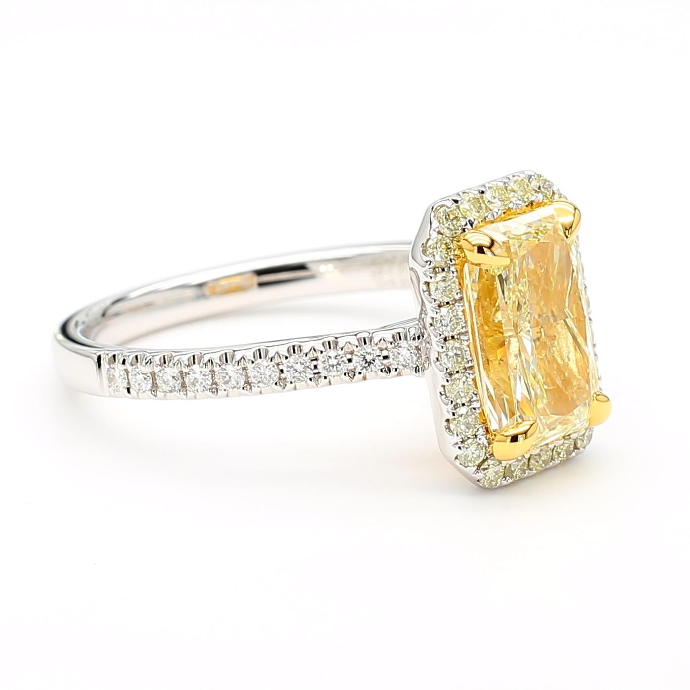 This very impressive Yellow Diamond Radiant Cut Ring with a yellow diamond halo is a testament to fine craftsmanship and timeless design. Perfect for those who appreciate the beauty of natural diamonds, this ring offers a balance of luxury and