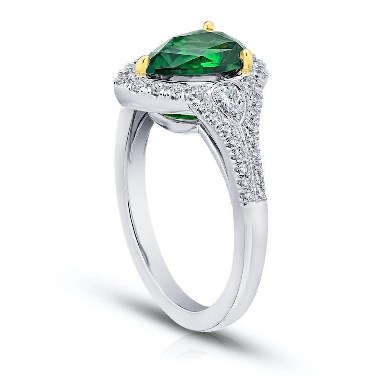 2.23 carat pear shape green tsavorite with 2 pear shape diamonds .16 carats and 48 round diamonds .31 carats set in a platinum and 18k yellow gold ring
