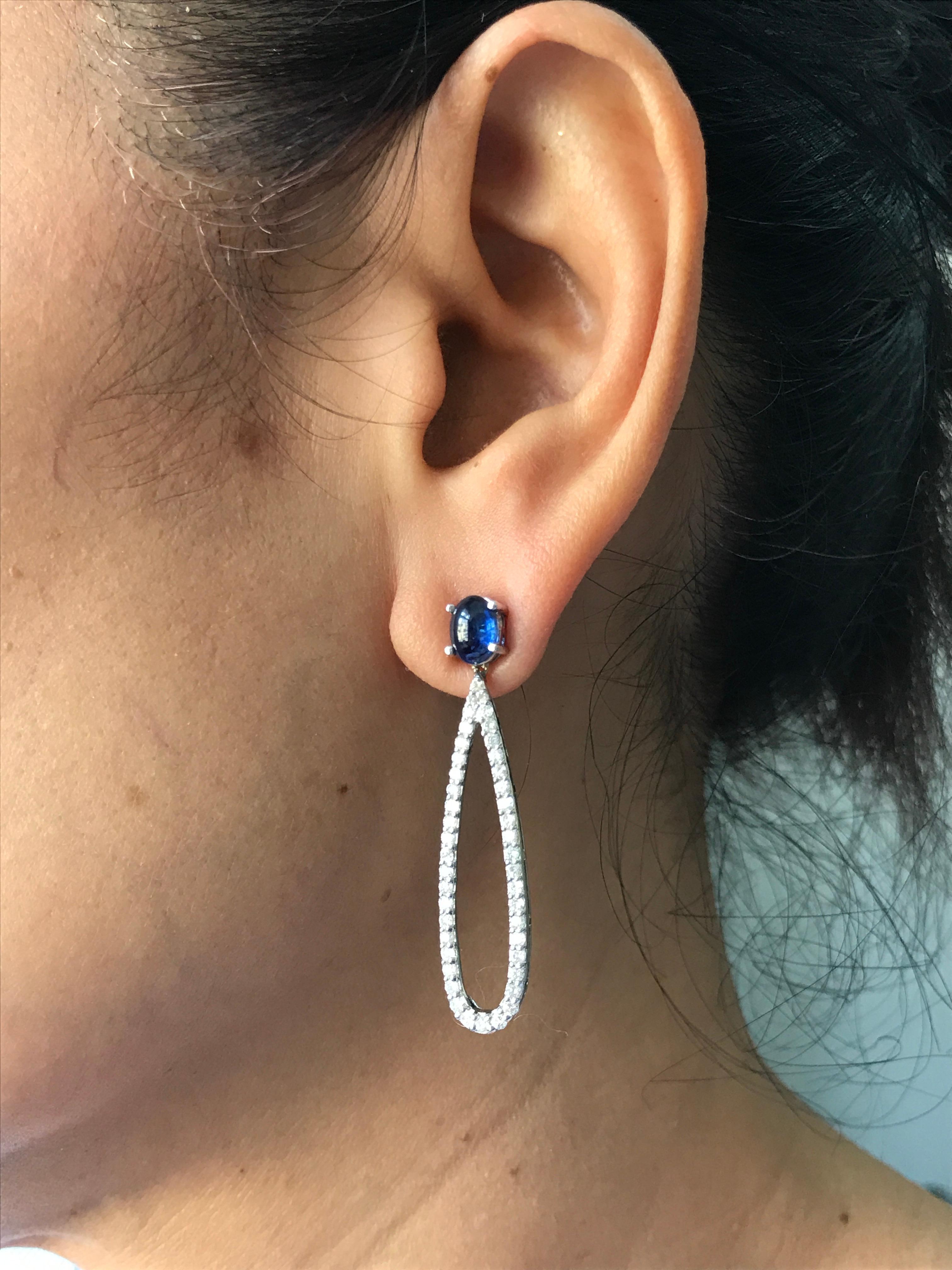 A beautiful, classic pair of dangling earrings with 2.23 carats of Blue Sapphire and VS/SI quality Diamonds. These are perfect to wear at any occasion, and will not go out of style! 