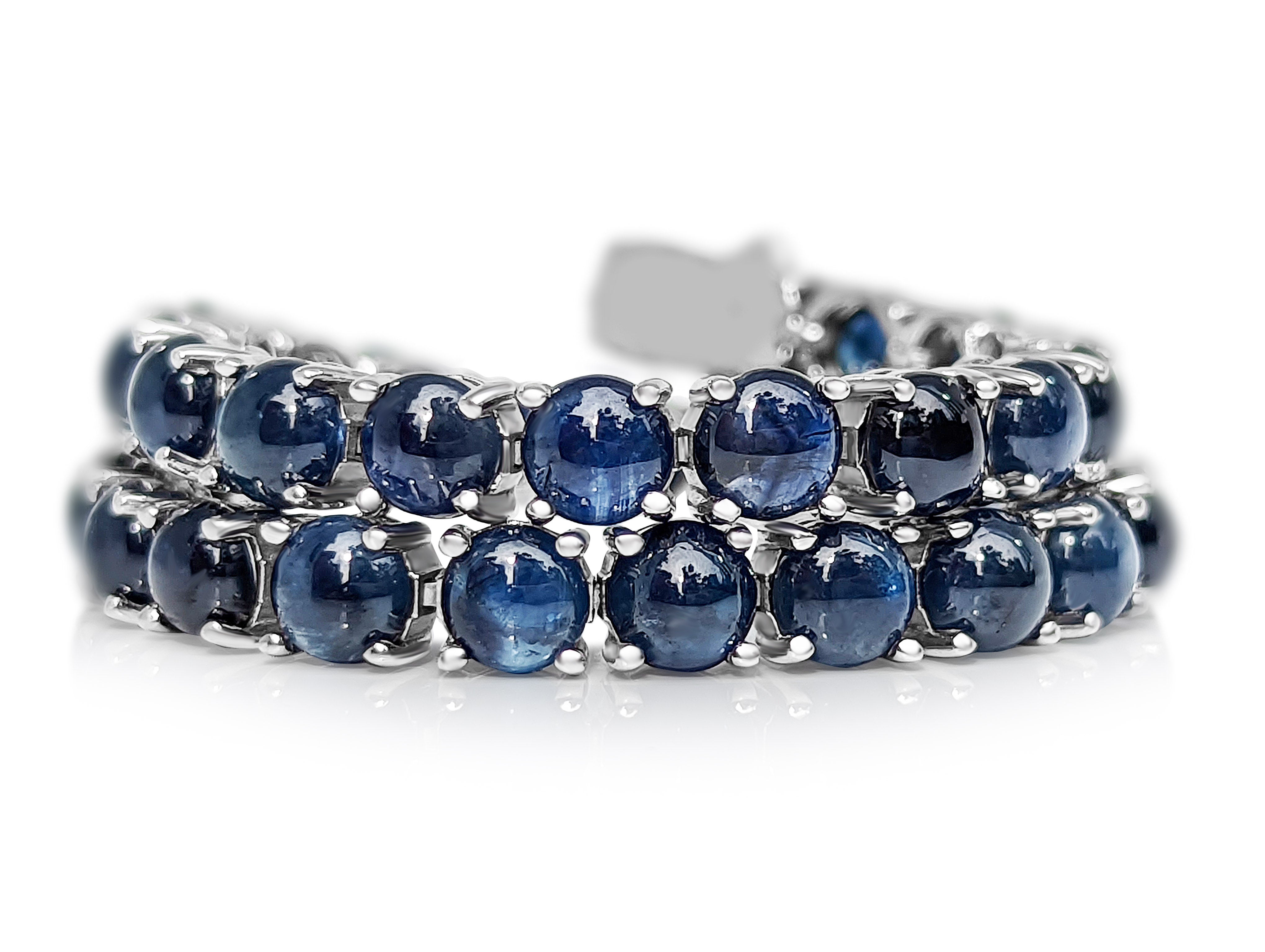 A truly one of a kind natural sapphire bracelet, set with 34 round cabochon total carat weight!
The bracelet will stand out in any occasion and is a wonderful gift for yourself or your loved one.

Center Natural Sapphires:
Weight: 22.30 ct, 34