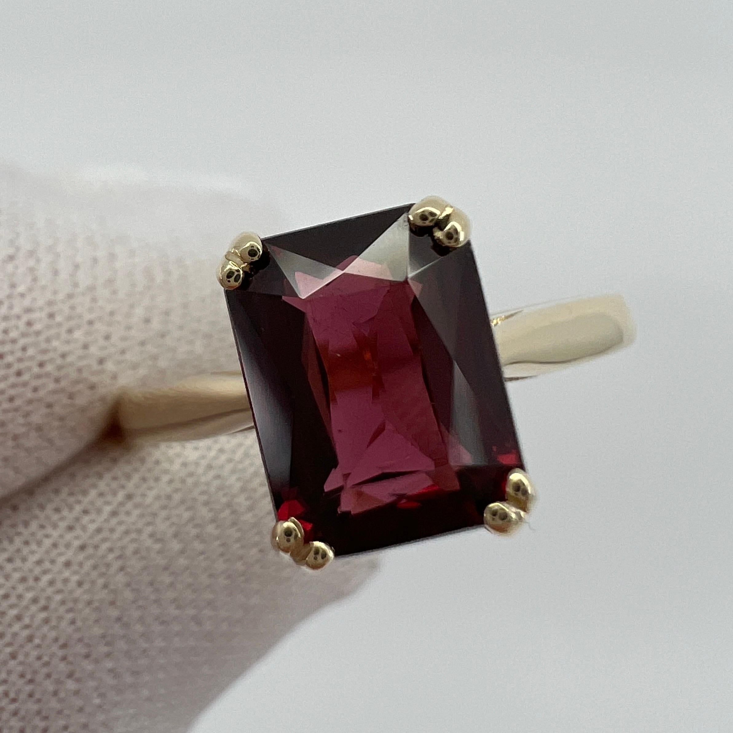 Vivid Pink Purple Rhodolite Garnet Emerald Octagonal Cut Yellow Gold Solitaire Ring.

2.23 Carat garnet with a stunning vivid pink purple colour and excellent clarity, very clean stone.

Also has an excellent quality fancy 'scissor' emerald octagon