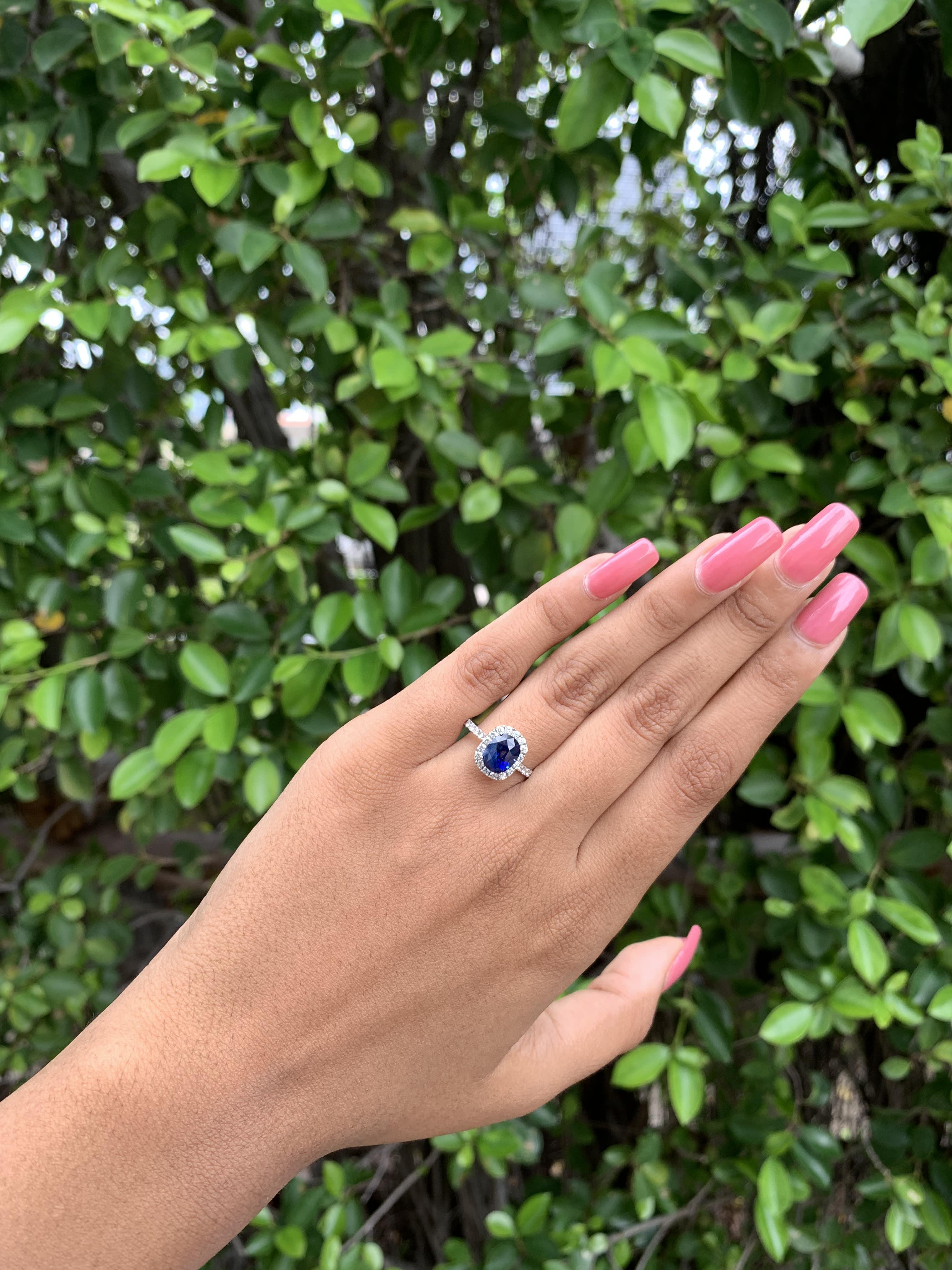Radiating timeless elegance, this extraordinary piece has been specially designed to accentuate the mesmerizing beauty of this mesmerizing royal blue sapphire.

The sapphire, a regal emblem of rich sophistication, boasts a captivating royal blue hue