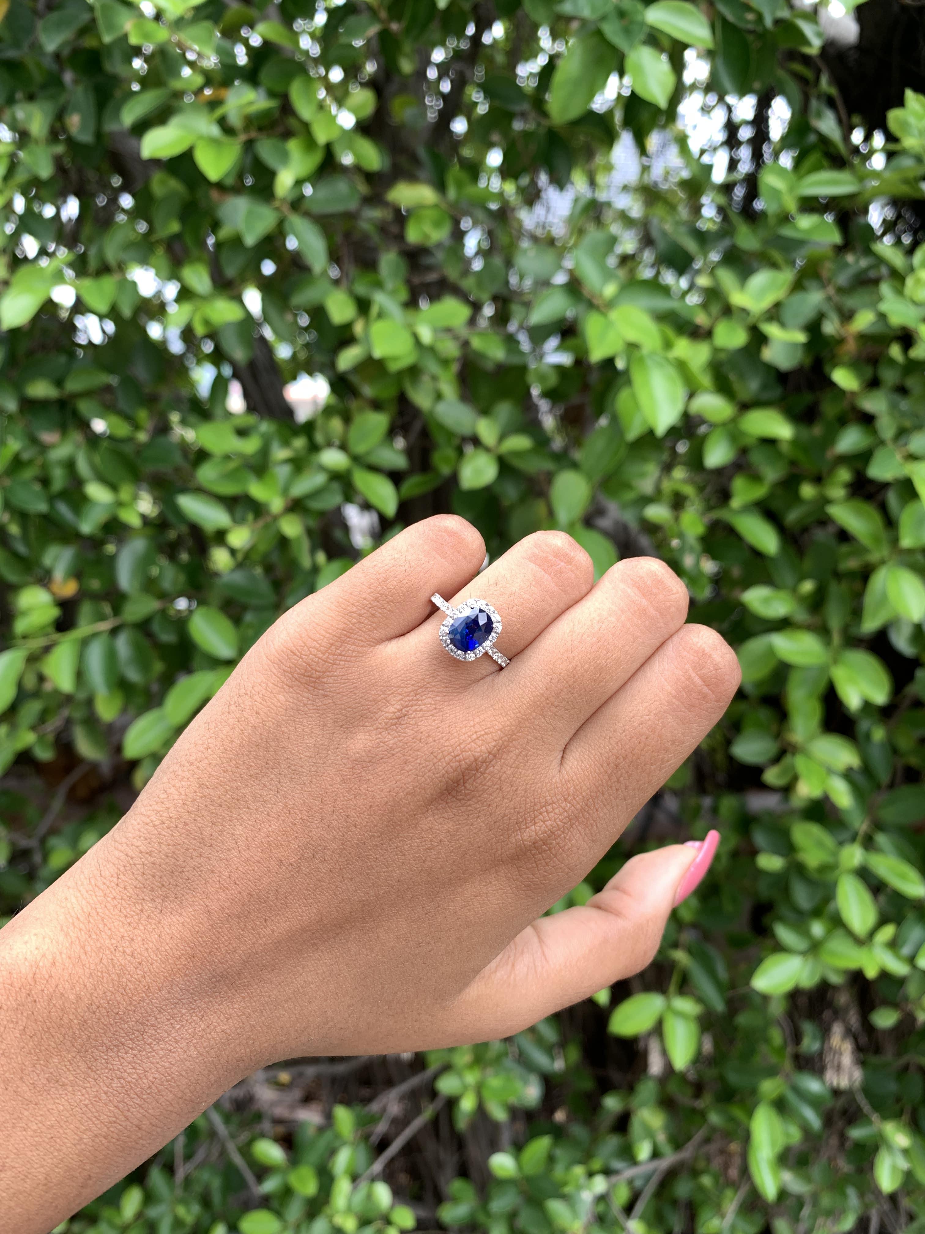 Modern 2.24 Ct Royal Blue Sapphire with Halo Diamonds 14K White Gold Ring For Sale