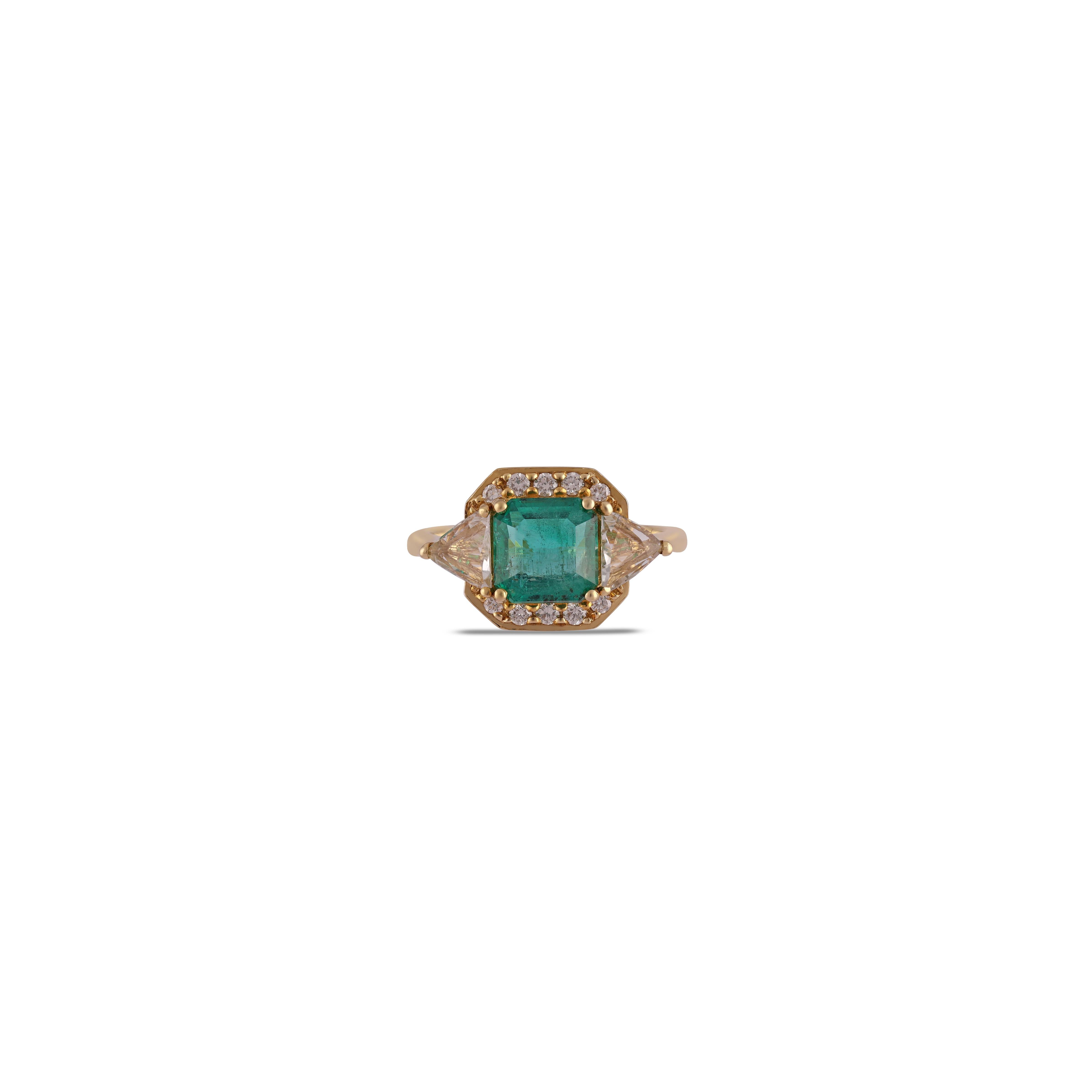 This is an elegant emerald & diamond ring studded in 18k Yellow gold with 1 piece of  Zambian emerald weight 2.24 carat which is surrounded by 10 pieces of round shaped diamonds weight 0.18 carat with White sapphire Weight 0.91 carat  this entire