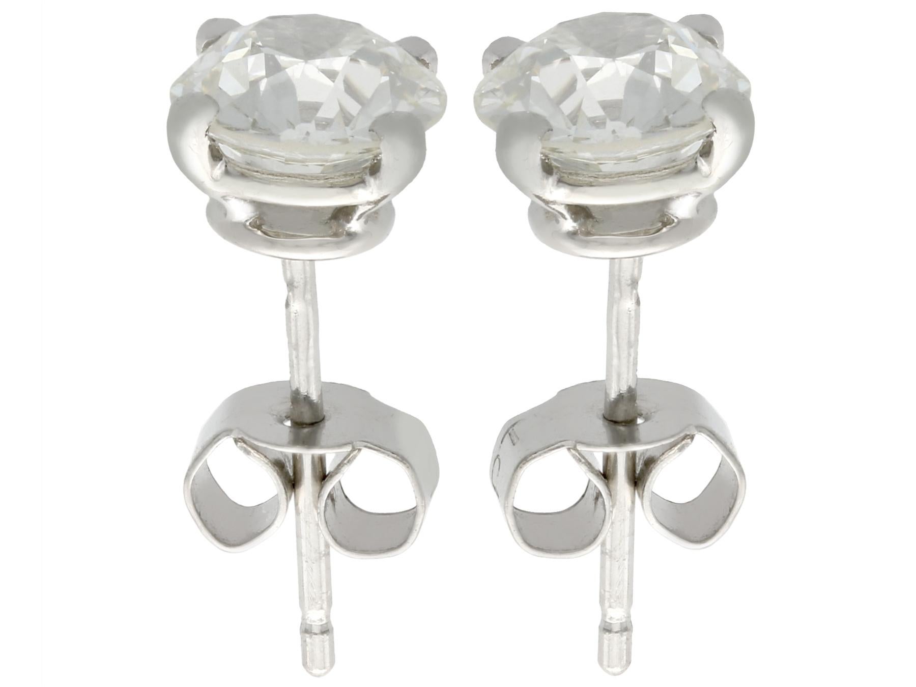 A stunning pair of antique and contemporary 2.24 carat diamond and platinum stud earrings; part of our diverse diamond jewelry and estate jewelry collections.

These stunning, fine and impressive platinum stud earrings have been crafted in