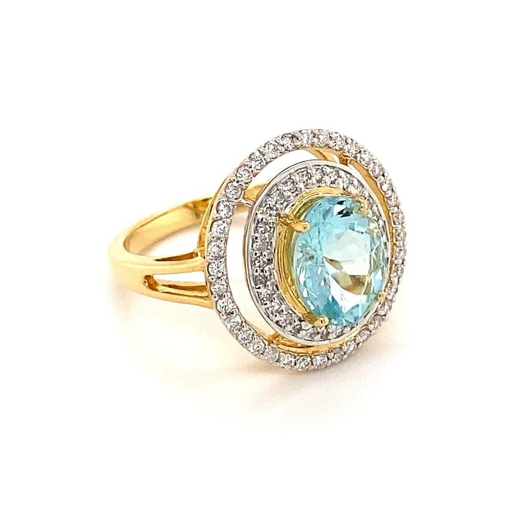Simply Beautiful! Finely detailed Paraiba Tourmaline and Diamond Gold Cocktail Ring. Centering a Hand set securely nestled 2.24 Carat Oval GIA Paraiba Tourmaline, GIA certificate # 5222824746, surrounded by Diamonds weighing approx. 0.38tcw. Hand