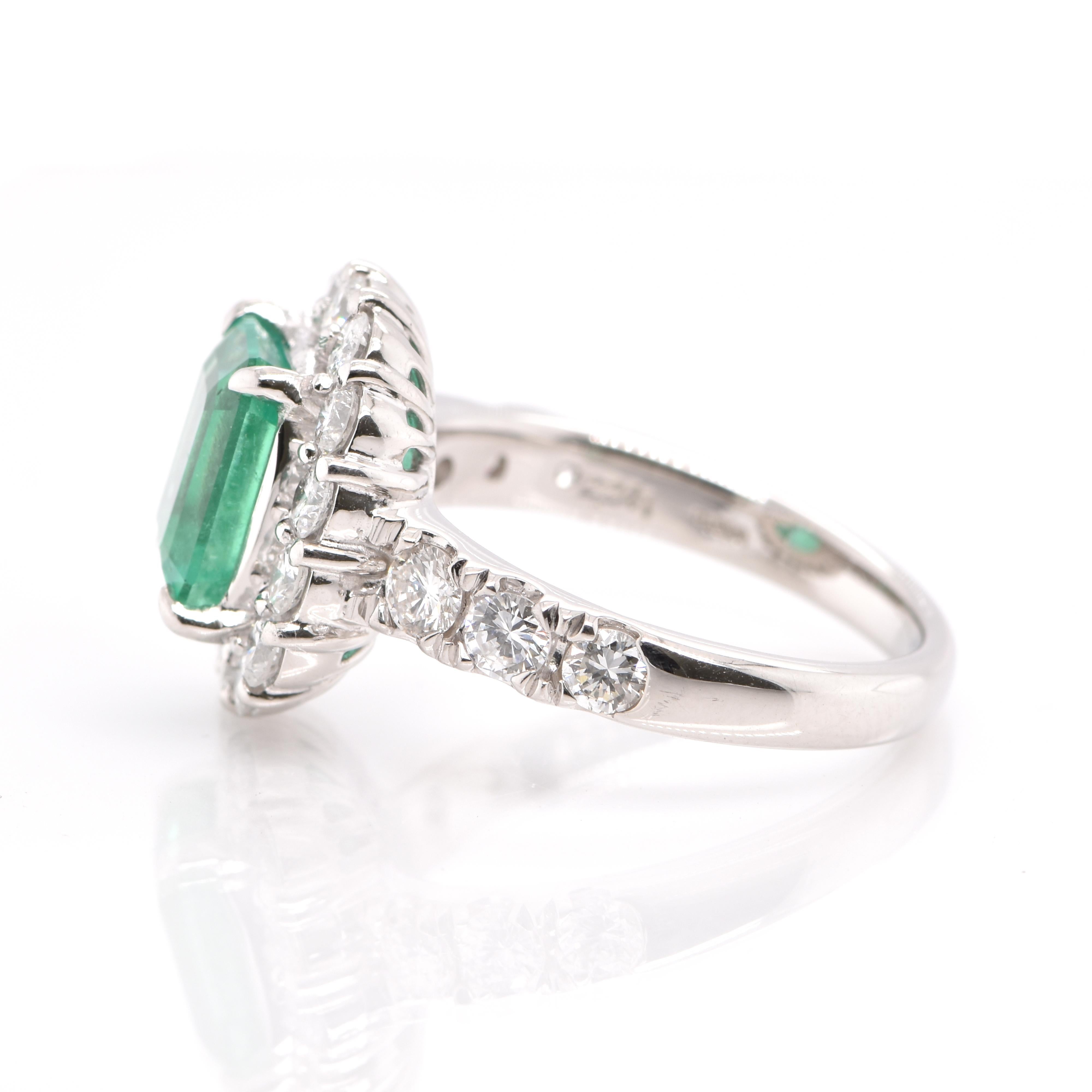 Emerald Cut 2.24 Carat Natural Emerald and Diamond Halo Engagement Ring Set in Platinum