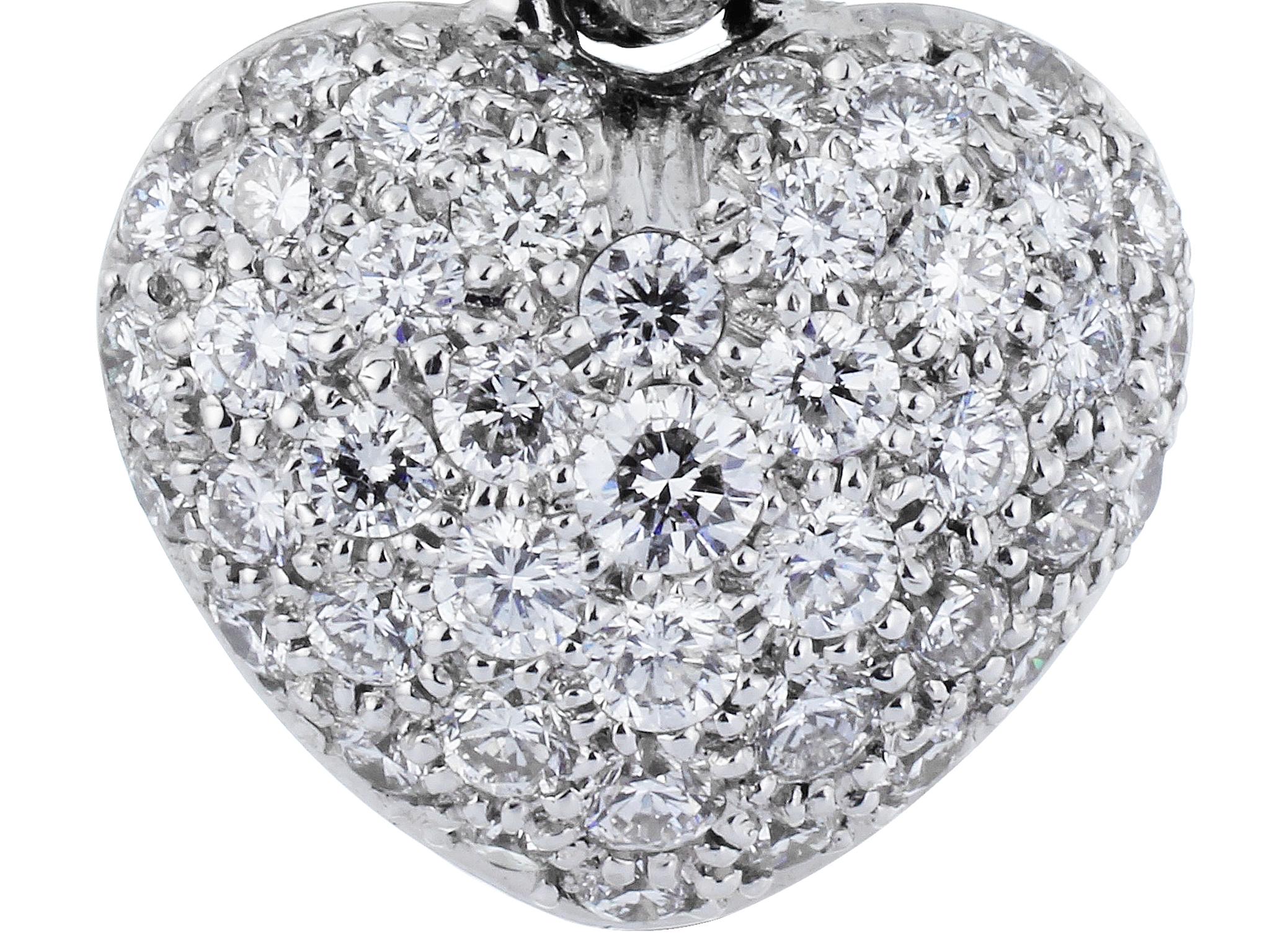 18 Karat white gold heart shape drop earrings consisting of 2.24 carats of full cut pave set diamonds.