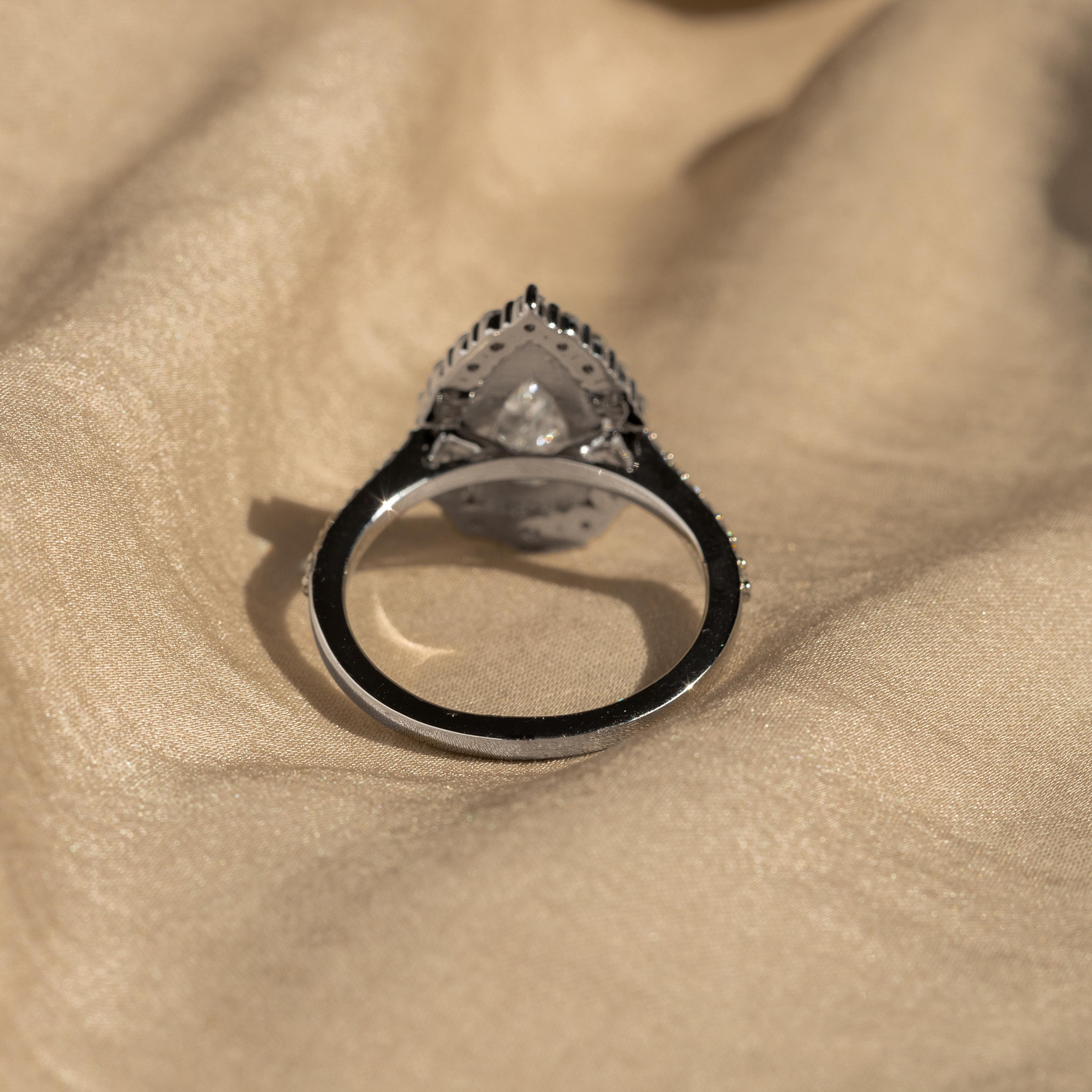Era: New
Composition: Platinum
Primary Stone: Pear Cut Diamond
Carat Weight: 2.24 Carat
Color/Clarity: G / SI1
GIA Report Number: 2205720961
View The GIA Report
Accent Stone: Thirty Round Brilliant Diamonds
Carat Weight: 0.84 Carats in