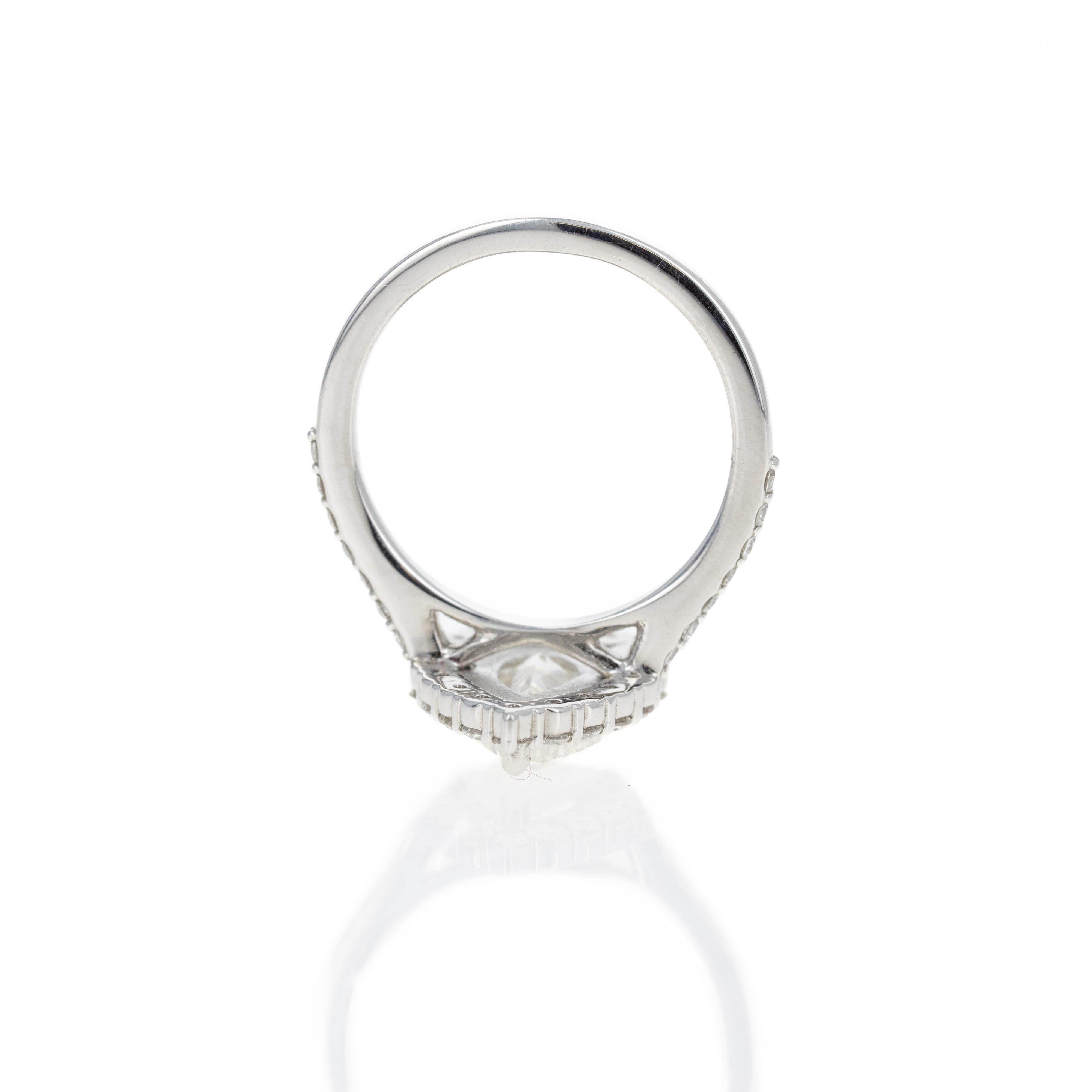 Women's 2.24 Carat Pear Diamond Graduated Halo Engagement Ring For Sale