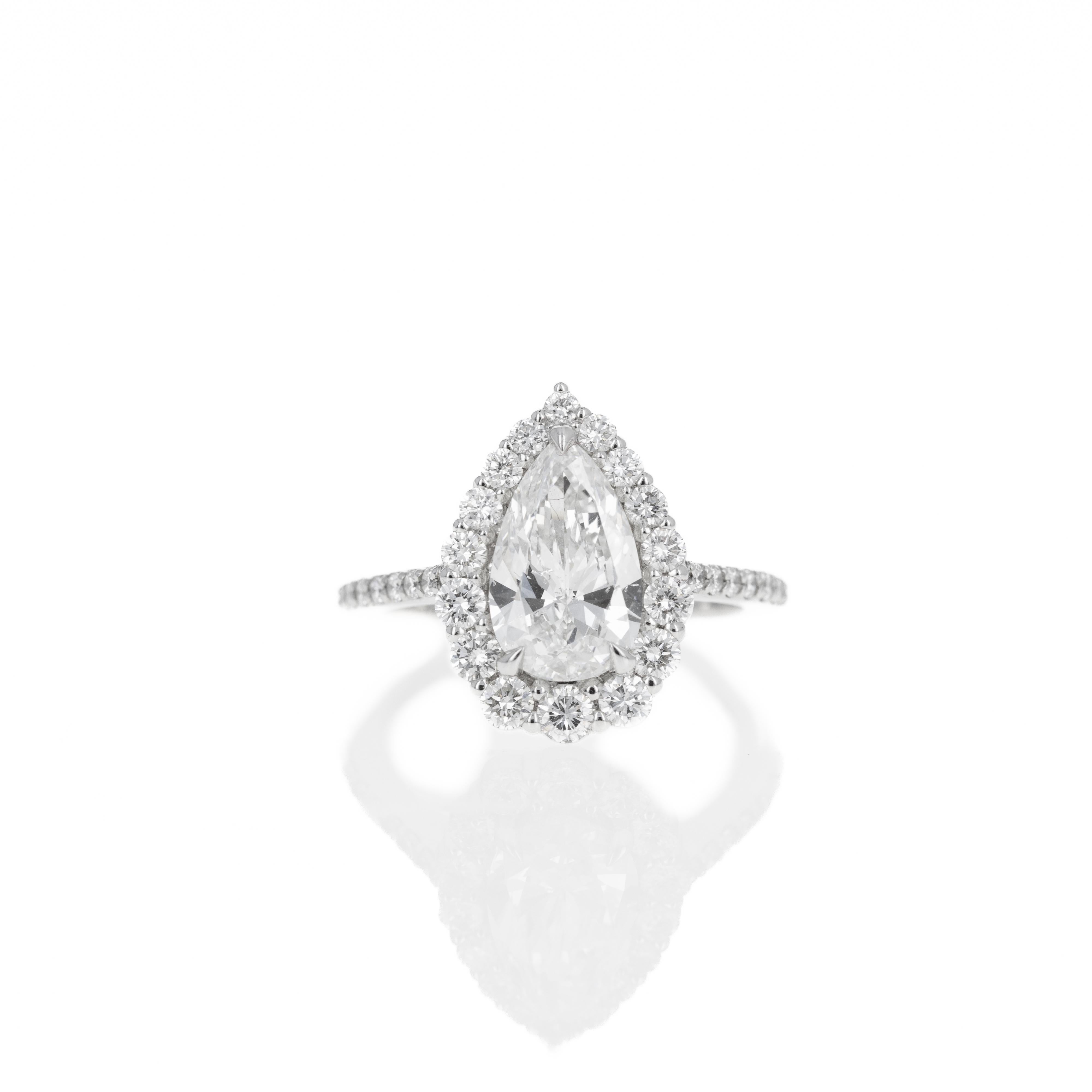 2.24 Carat Pear Diamond Graduated Halo Engagement Ring For Sale 3