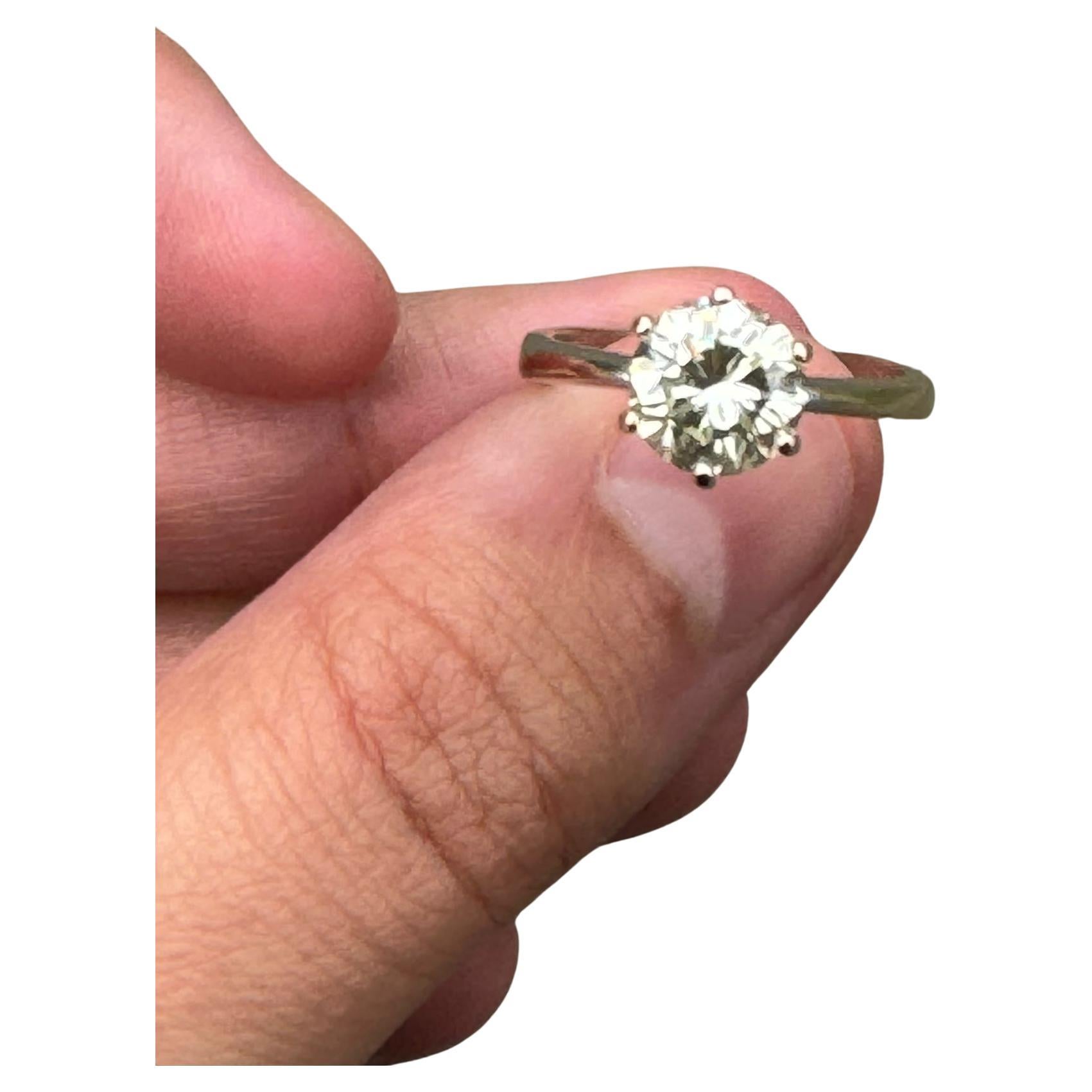 This Beautiful Diamond ring features a centre round brilliant cut Natural diamond weighing 2.24 carats. The diamond is M colour and VS2 clarity.

Details: 
• Gold : 18K White Gold
• Ring size: 7.5
• Gemstone: Diamond
• Type : Natural
• Shape & Cut :