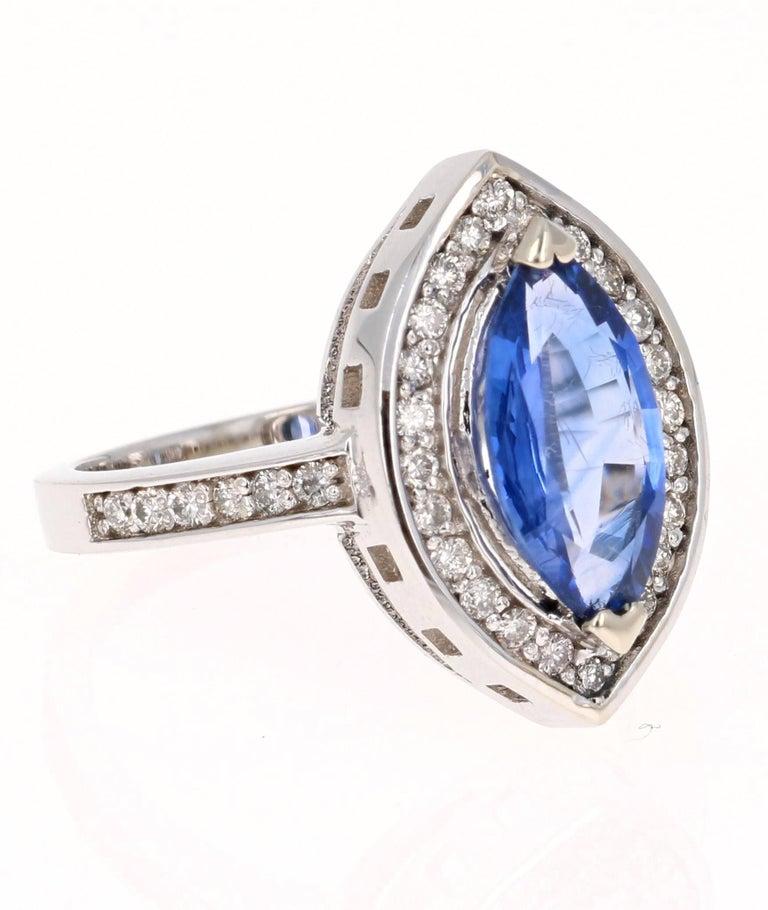 This unique Tanzanite Diamond Ring has a stunning 1.89 Carat Marquise Cut Tanzanite as its center stone and has 36 Round Cut Diamonds that weigh 0.35 Carats. The Total Carat weight of the ring is 2.24 Carats. The Tanzanite has a really great bluish