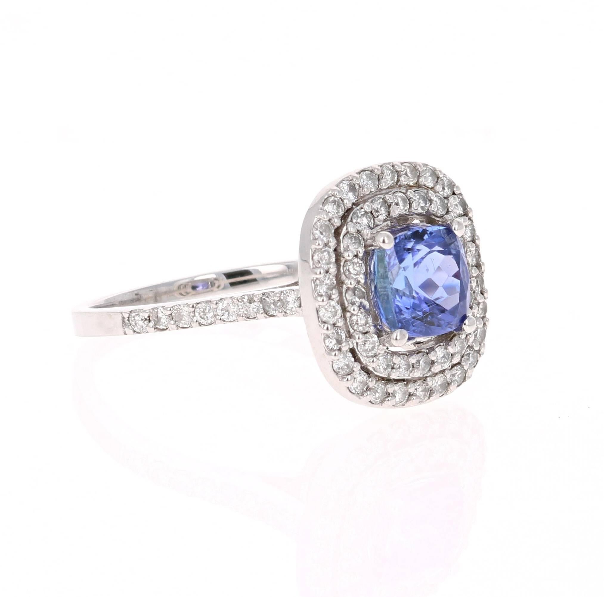 This gorgeous ring has a 1.58 Carat Tanzanite that is set in the center of the ring.  The Tanzanite is surrounded by a double Halo of 68 Round Cut Diamonds that weigh 0.66 carats. The total carat weight of the ring is 2.24 carats.   

The ring is
