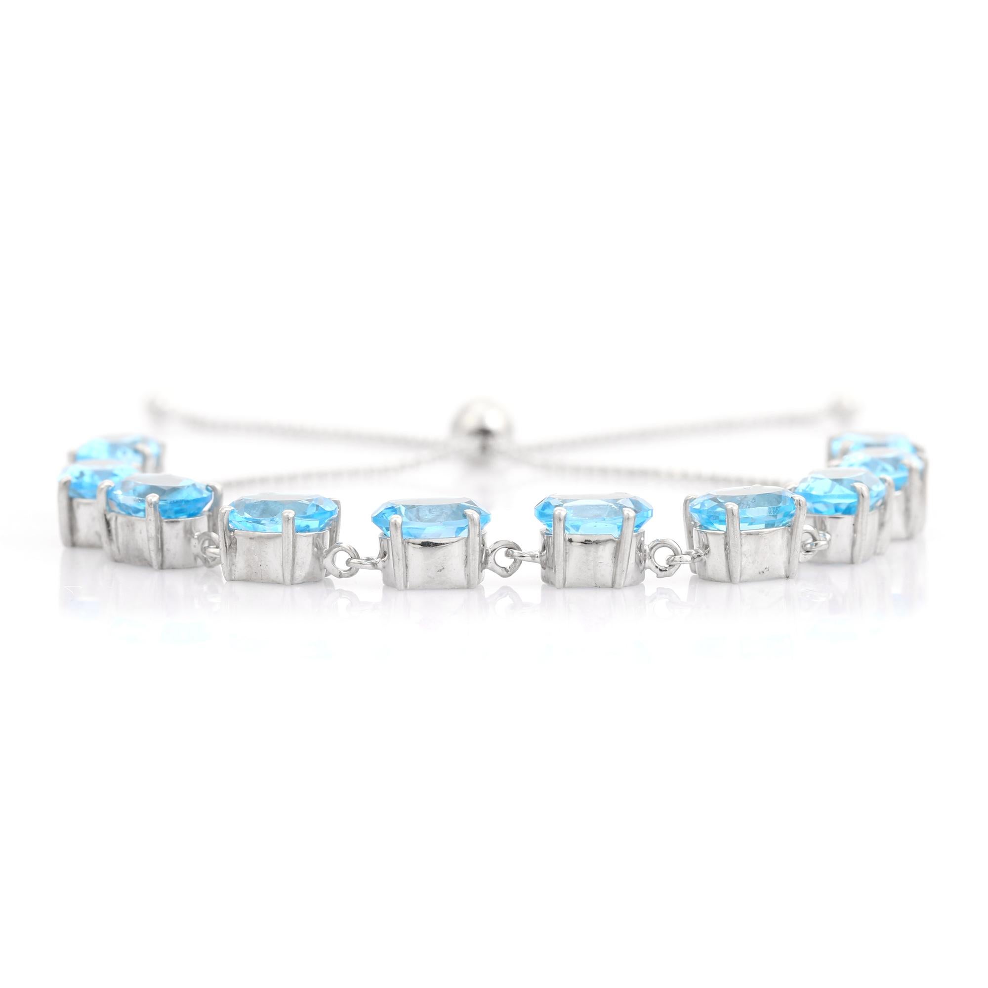This 22.45 Carat Natural Blue Topaz Adjustable Bolo Silver Bracelet stunning 925 sterling silver bolo bracelet, adorned with a graceful line of oval-cut blue topaz gemstones. Each gem radiates a captivating sky-blue hue, set securely in prong