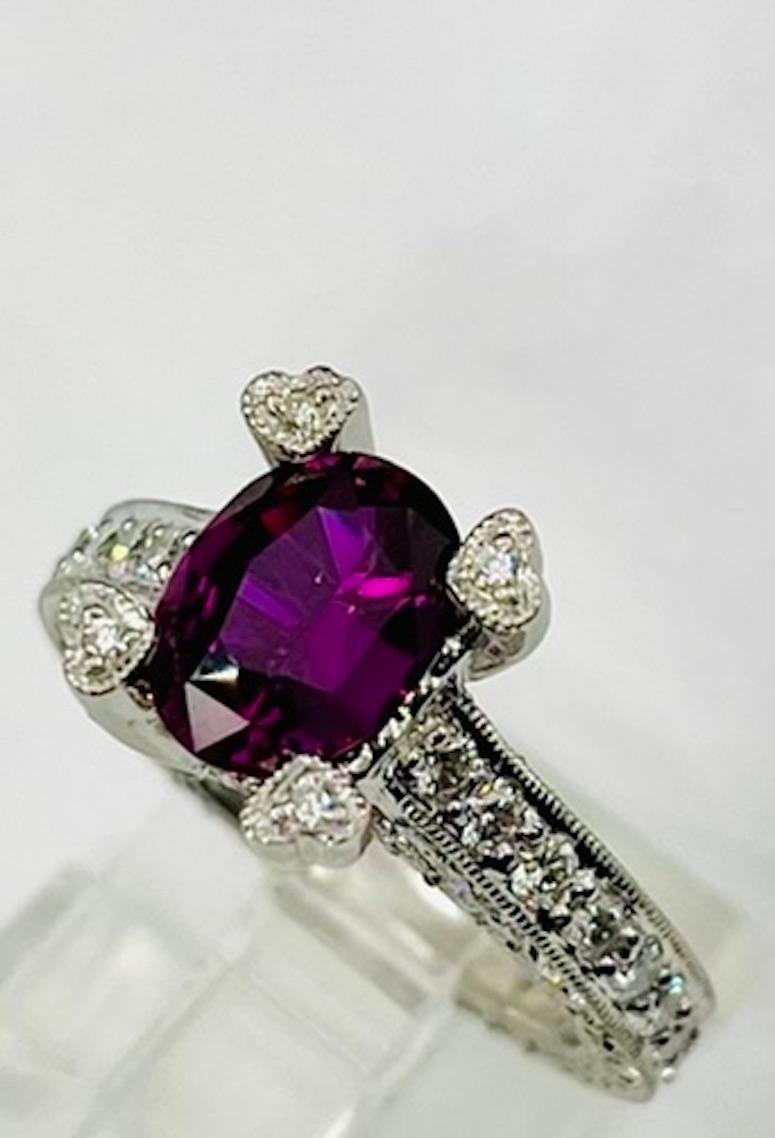 This truly one of a kind sapphire is intensely rich and deep in color while being incredibly clear, bright, and microscopically clean. Pink Sapphires very rarely come in this shade of dark Fuchsia, especially in this carat size. The color is evenly