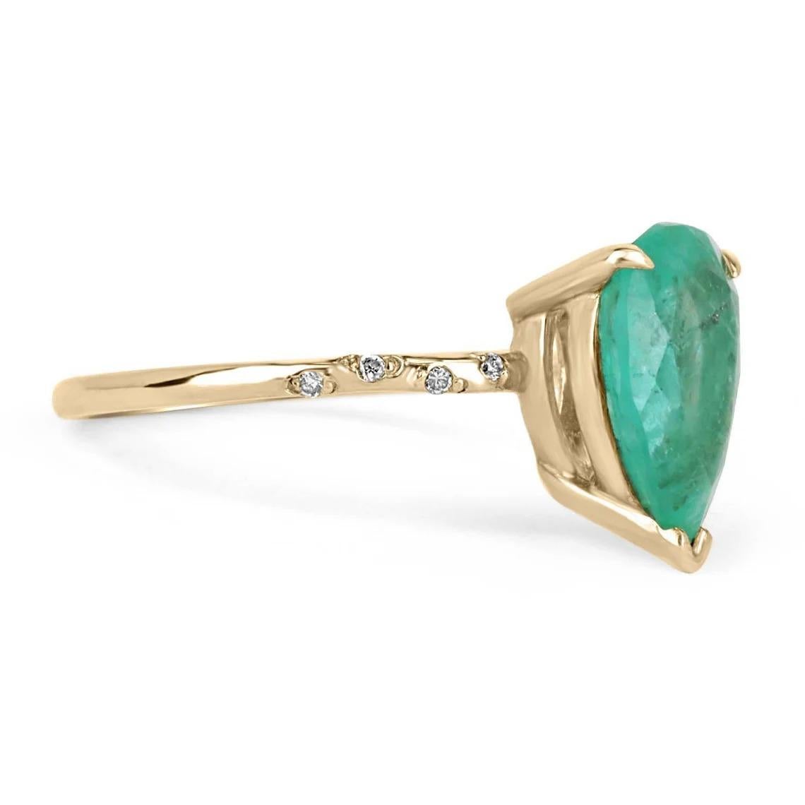 Setting Style: Solitaire w/ Accents
Setting Material: 14K Yellow Gold
Weight: 2.2 Grams

Main Stone: Colombian Emerald
Shape: Pear Cut
Approx Weight: 2.14-Carats
Color: Green
Luster: Very Good - Good
Origin: Colombia
Treatments: Natural,