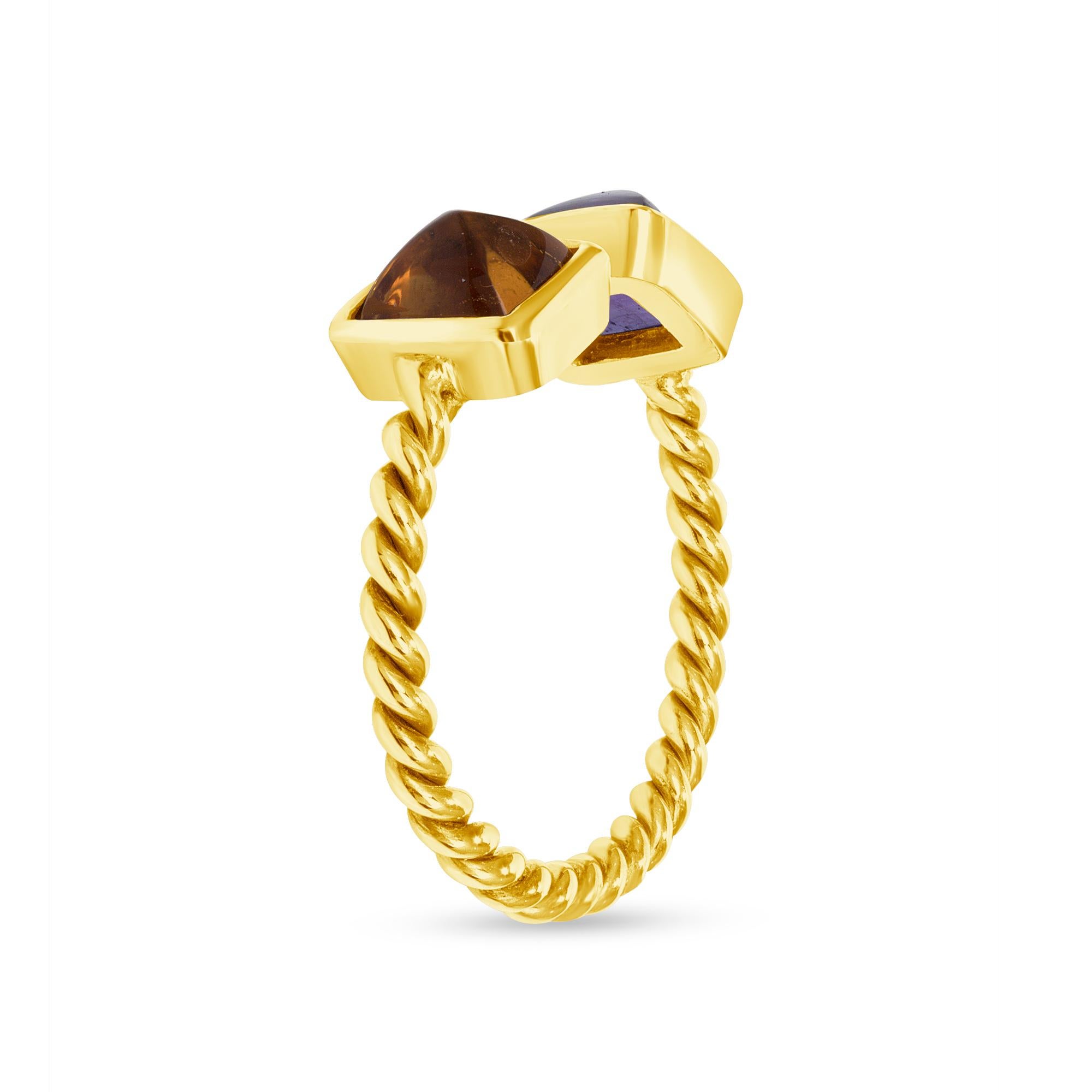 Designed by award-winning artist Brenda Smith, this size 5-7 ​​twist textured open shank ring features meticulously cut sugarloaf citrine and amethyst cabochon set in 14-karat yellow gold. This ring represents the signature style of Brenda Smith by