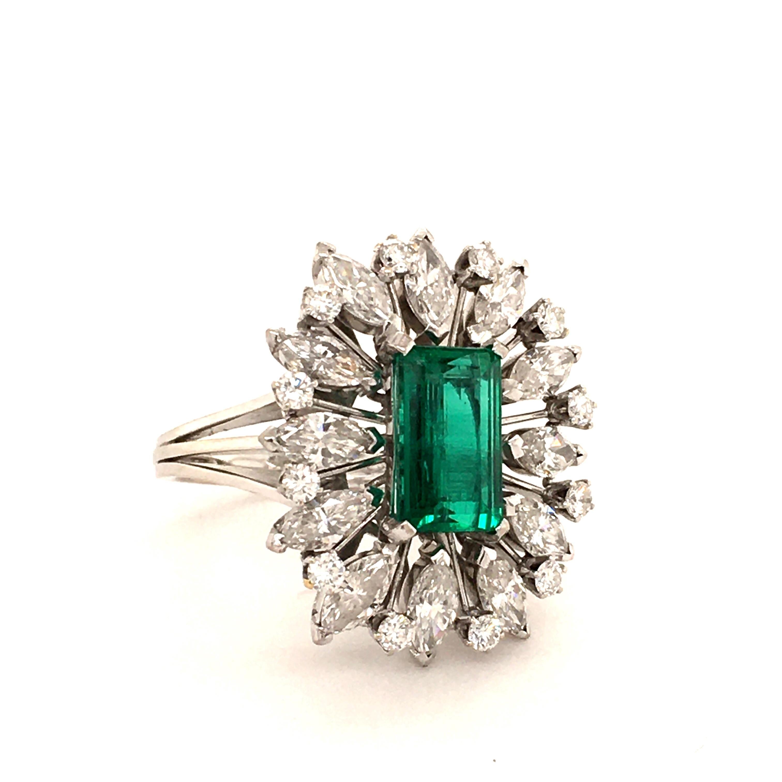 This splendid ring features a 2.25 carat Colombian emerald of vibrant colour and very good quality. Surrounded by 12 marquise-cut and 12 brilliant-cut diamonds of G/H colour and vvs/vs clarity, total weight approximately 3.00 carats.

The emerald is
