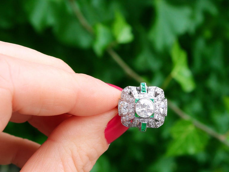A stunning, fine and impressive vintage Art Deco 2.25 carat diamond and 0.27 carat emerald, platinum cluster ring; part of our diverse emerald jewelry and estate jewelry collections.

This stunning, fine and impressive antique emerald and diamond