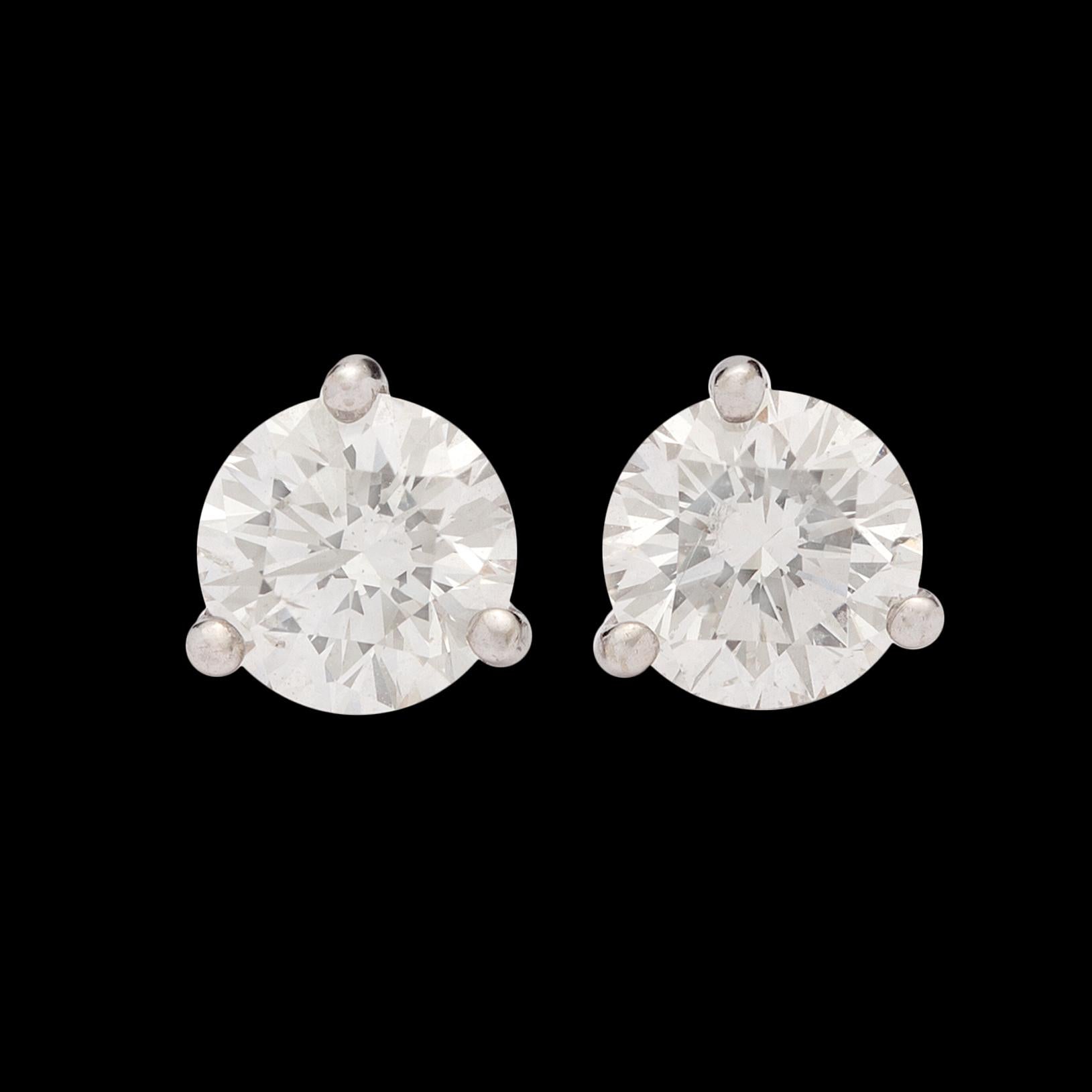 Two diamonds full of sparkle and fire come together to make one fantastic pair of stud earrings. Featuring EGL certificates that grade the stones as I color with VS1 and VS2 clarity, this exceptionally well matched pair weighs in at an impressive