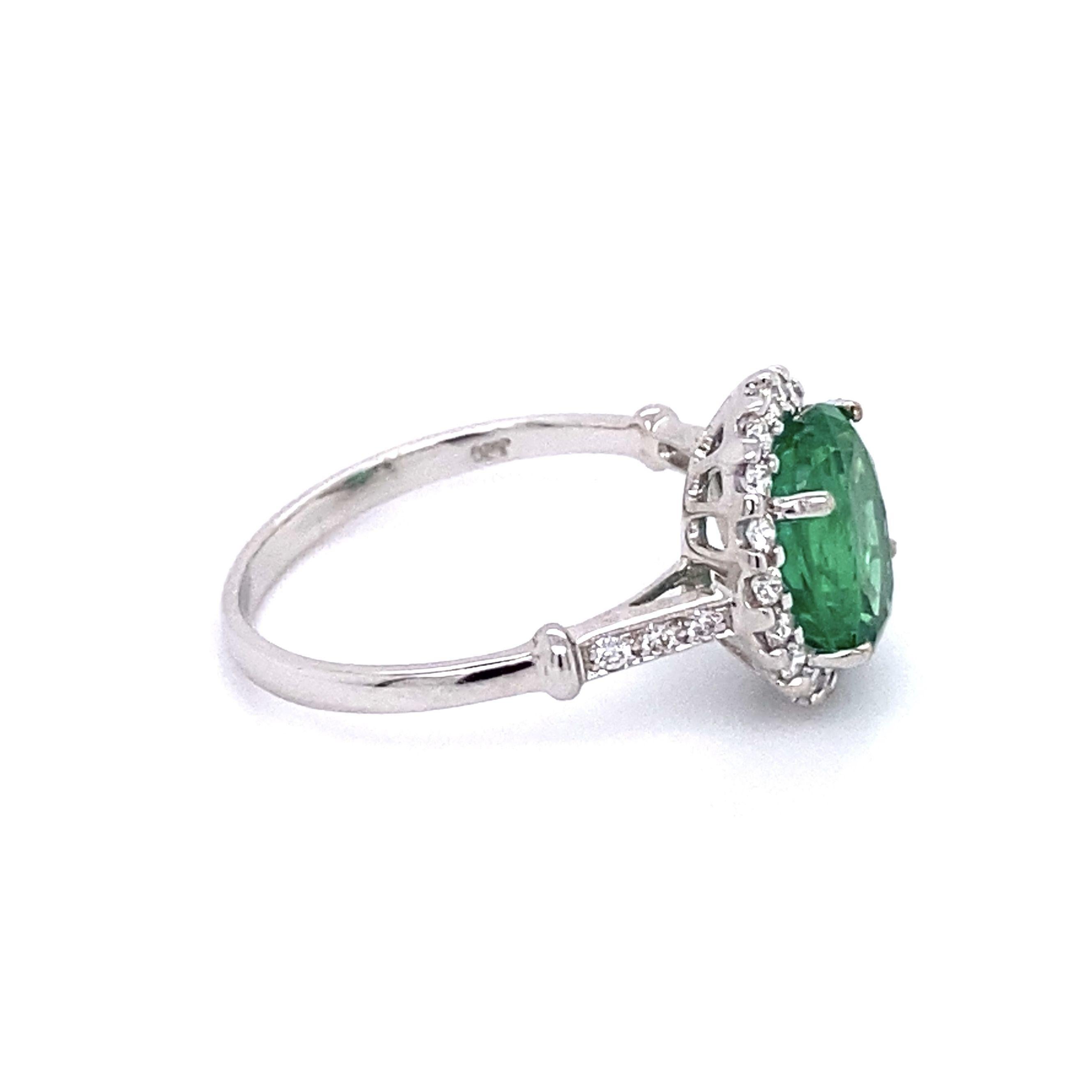 Simply Beautiful! Finely detailed Gold Cocktail Ring, center securely nestled with an Oval Emerald GIA, weighing approx. 2.25 Carats surrounded by Diamonds; approx. total weight of Diamonds 0.33 Carats. Approx. dimensions: 0.95” l x 0.75” w x 0.48”