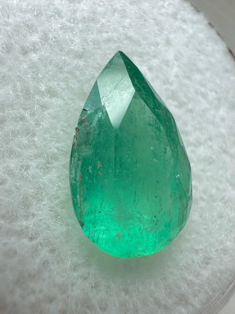 Stone: Emerald
Weight: 2.25-carats
Shape: Pear Cut
Clarity: Semi-Transparent
Luster: Very Good
Color: Medium Green
Measurements: 12.31mm x 8.19mm x 6.54mm
Geographic Origin: Colombia
Treatment: Natural, Oiling

Comments: Due to their growth