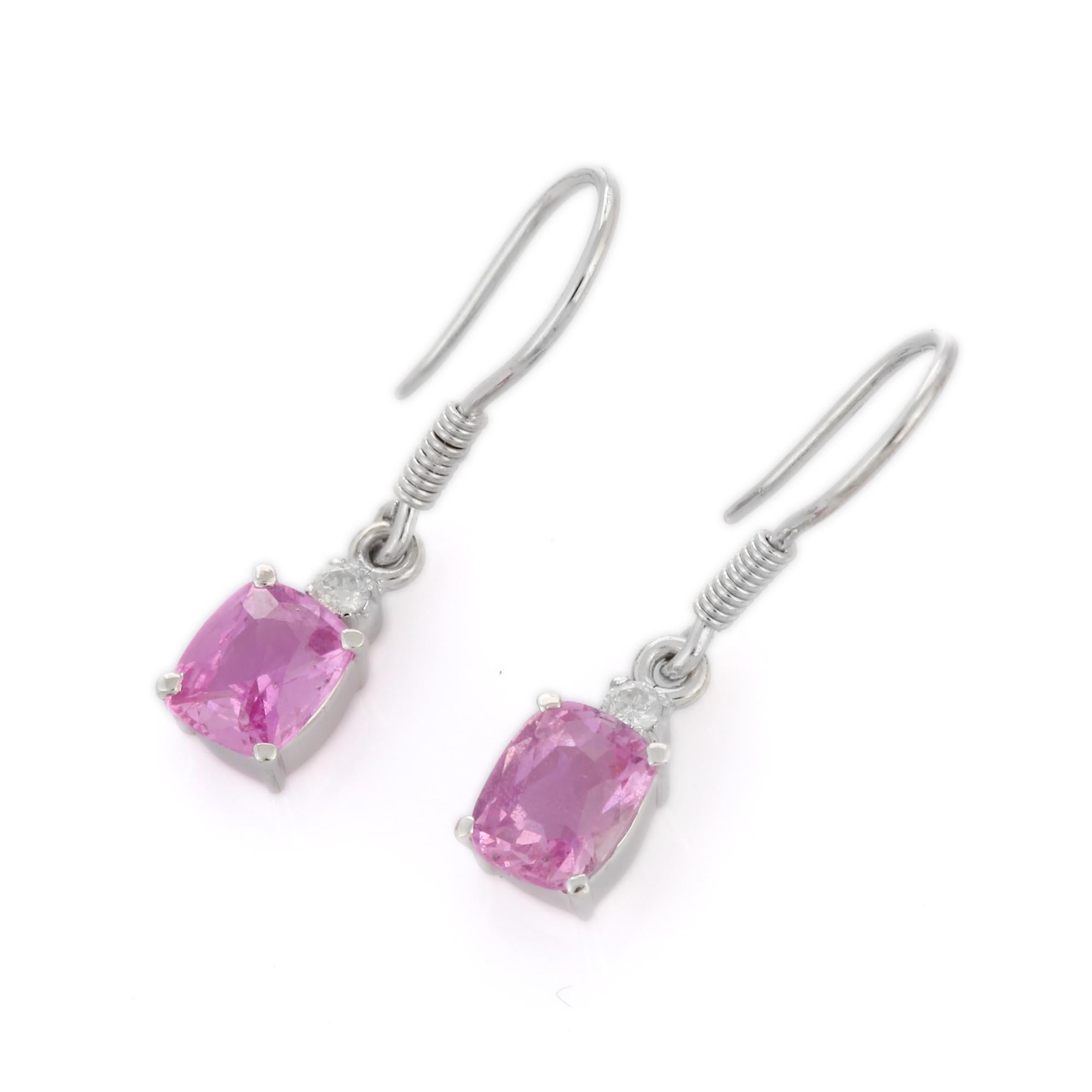 Pink Sapphire Dangle earrings to make a statement with your look. These earrings create a sparkling, luxurious look featuring cushion cut gemstone.
If you love to gravitate towards unique styles, this piece of jewelry is perfect for you.

PRODUCT