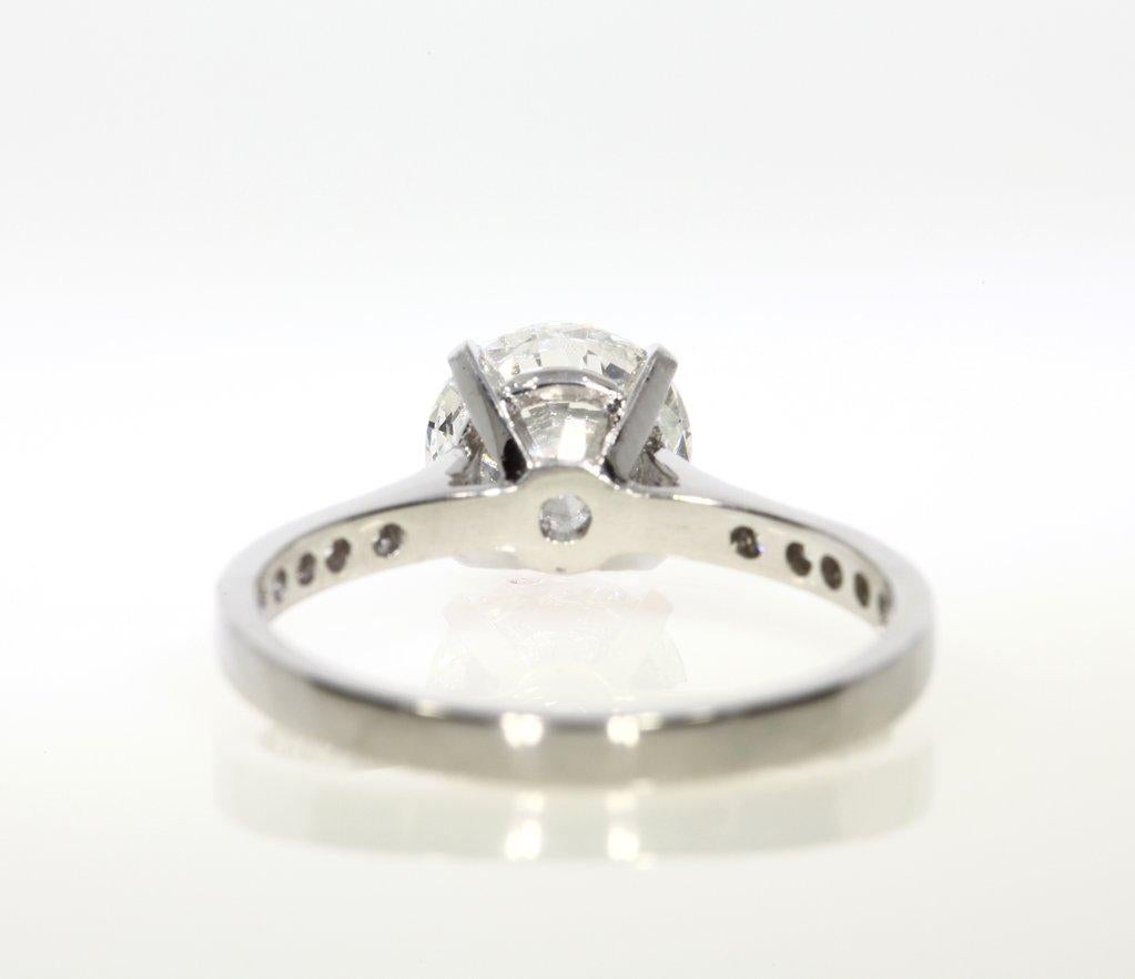 This beautiful round brilliant cut diamond engagement ring is so elegant. The simplicity is gorgeous yet the fine detail makes the piece. The stunning 2.00ct round brillaint cut center diamond is GIA certified at I-SI2. It is whiteand eye clean. It