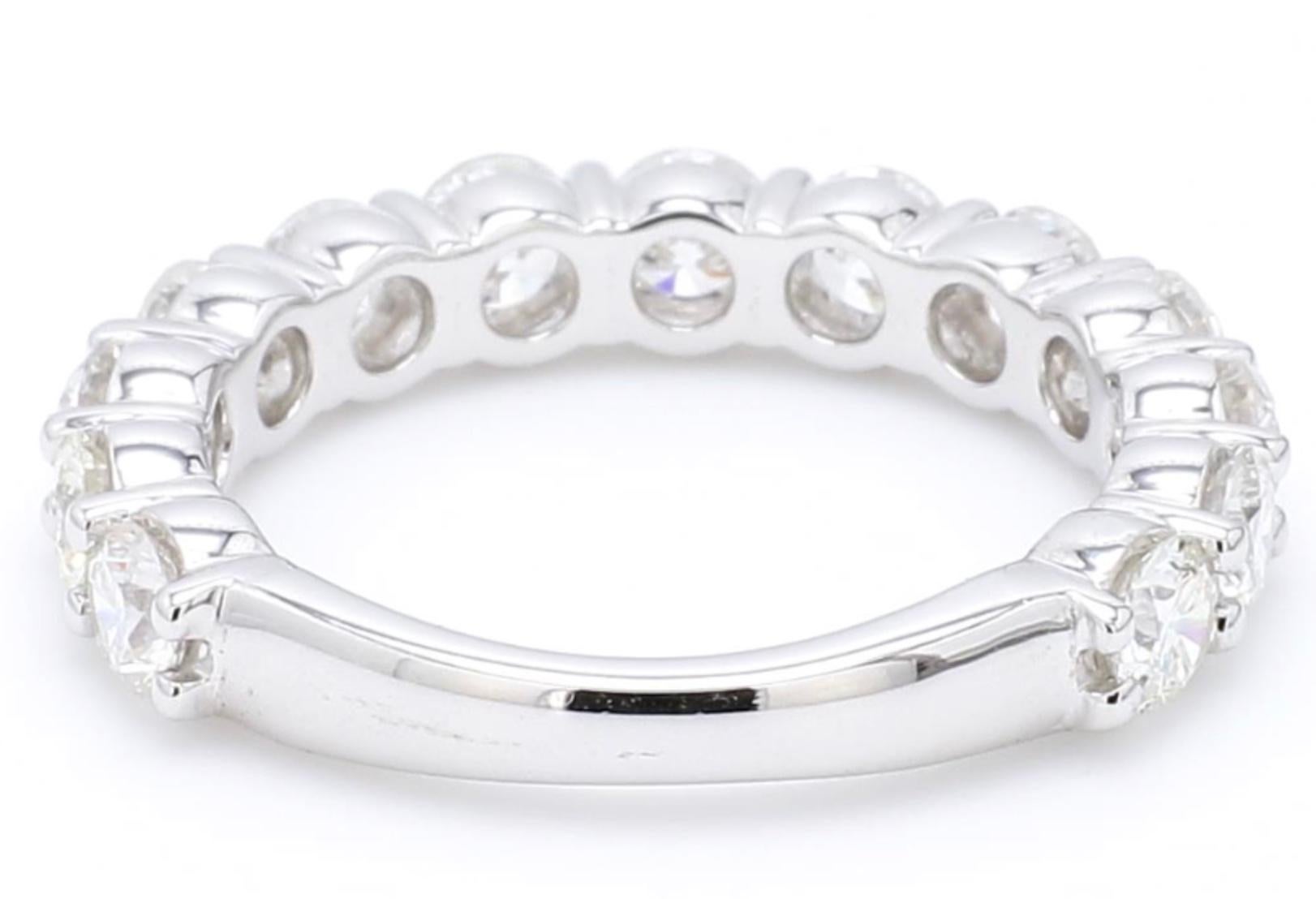 A Beautiful Handcrafted Eternity Wedding Ring in 18K White Gold with Natural Brilliant Round Brilliant Cut Diamond . A perfect Wedding Ring.  Each diamond is 3.50 mm size and  0.18 Carat Size

A continuous circle of Round diamonds gives this 2.25