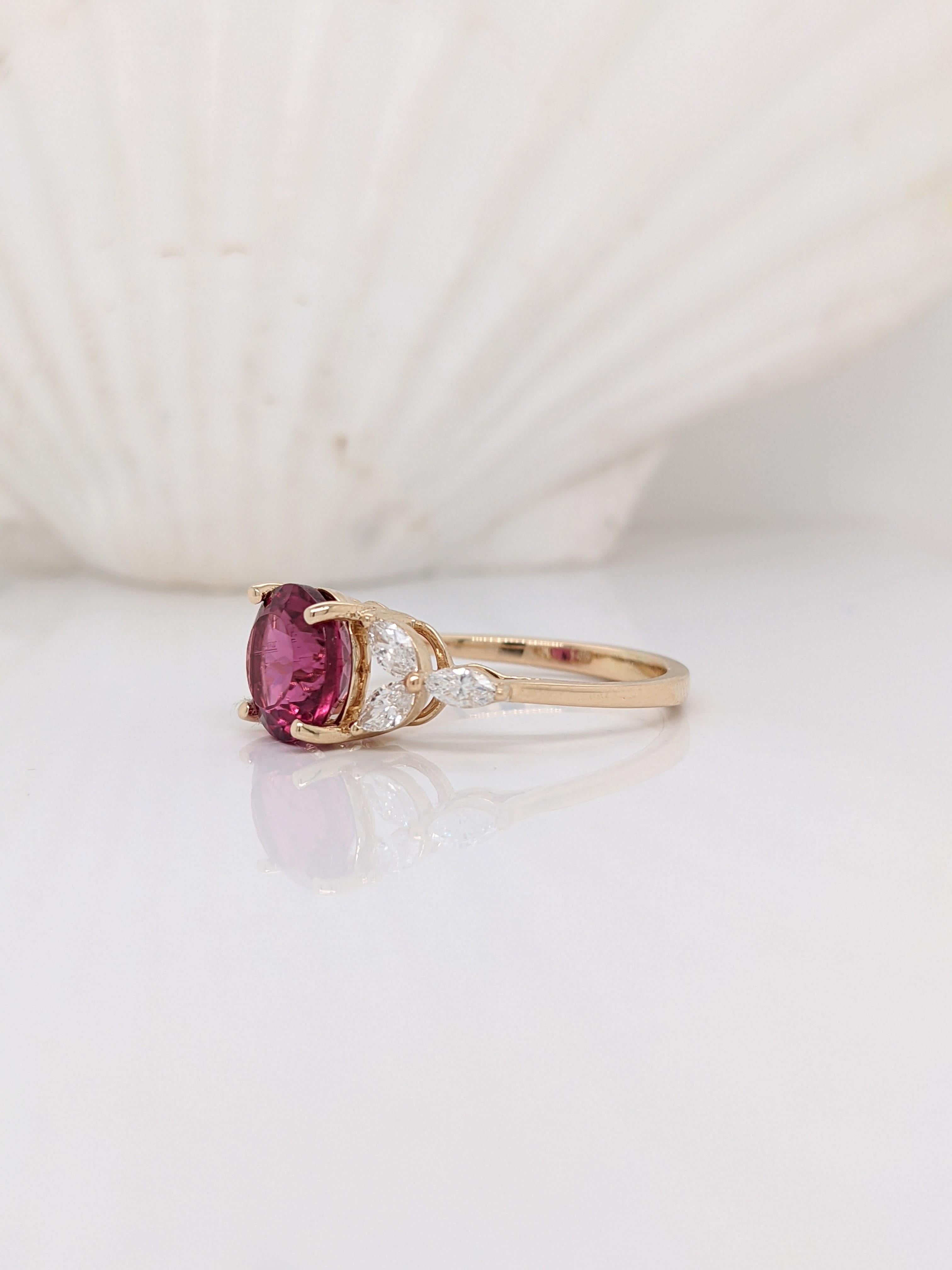 Bright and bold red-magenta Rubellite Tourmaline ring in 14k yellow gold. This stunning center stone is surrounded by marquis diamond accents giving it a floral look. A perfect ring for a unique bride.

Perfect for special occasions such as