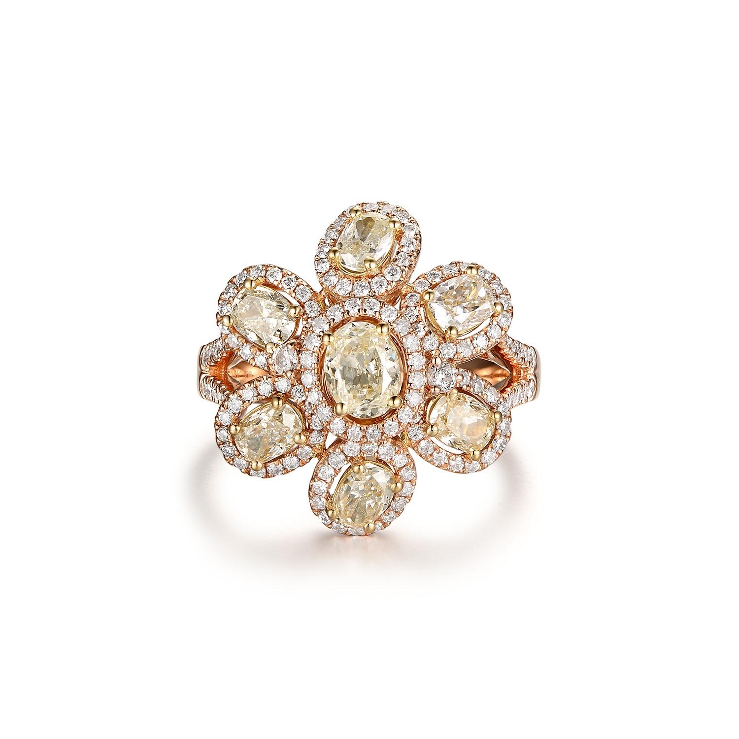 This ring features 7 diamonds weight 1.6 carats and assented with 0.65 carat of smaller diamonds. Ring is set in 18 karat rose gold. 

US 6.5
Resizing is available 
7 Diamonds 1.60 carats
White Round Diamonds 0.65 carat