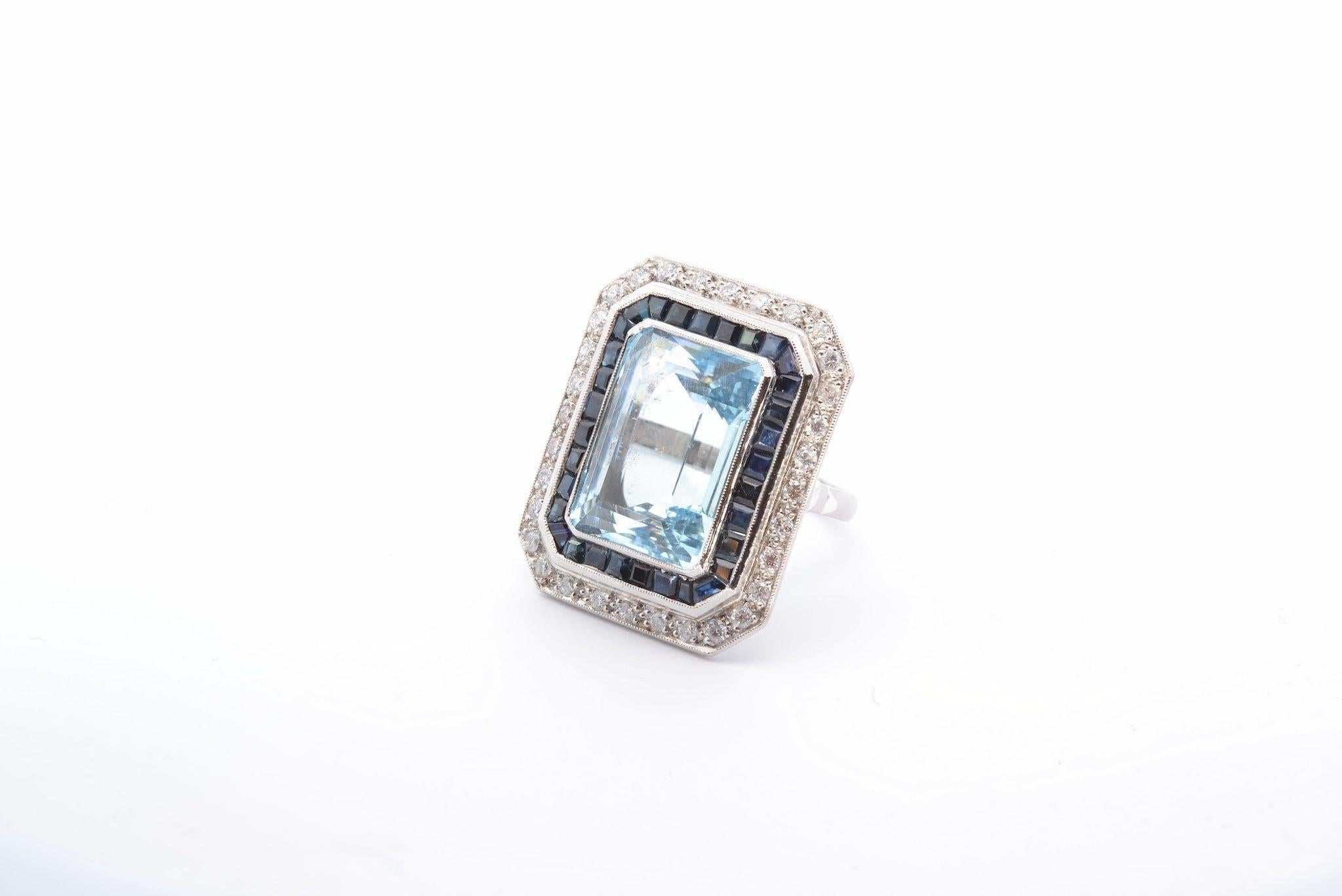 Emerald Cut 22.5 carats Aquamarine, diamonds and sapphires ring