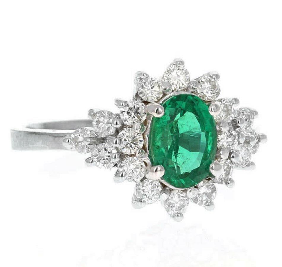 2.25 Carats Natural Emerald and Diamond 14K Solid White Gold Ring

Suggested Replacement Value: $5,200.00

Total Natural Green Emerald Weight is: Approx. 1.50 Carats (transparent)

Emerald Measures: 9 x 7mm

Natural Round Diamonds Weight: Approx.