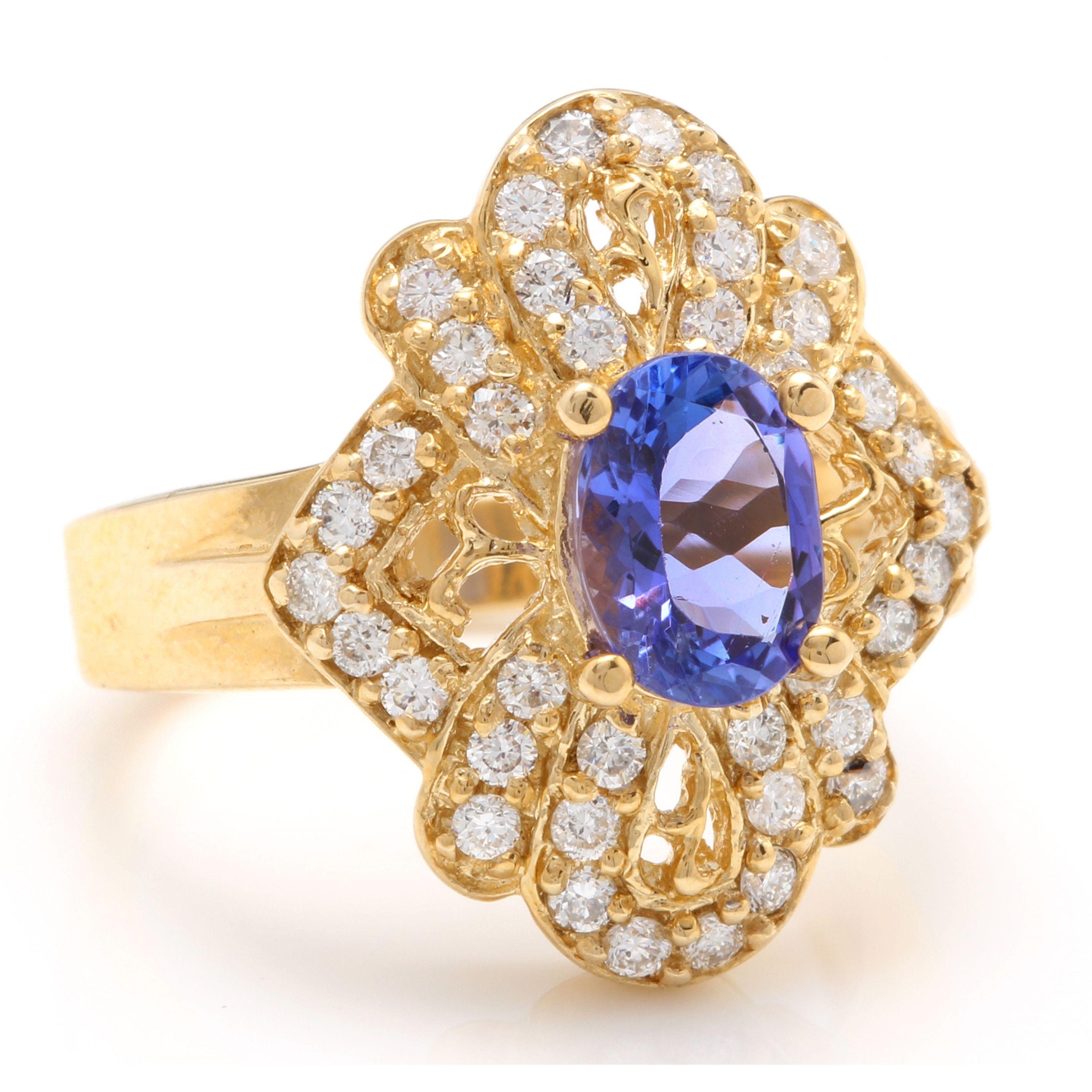 2.25 Carats Natural Very Nice Looking Tanzanite and Diamond 14K Solid Yellow Gold Ring

Total Natural Oval Cut Tanzanite Weight is: Approx. 1.40 Carats

Tanzanite Measures: Approx. 8.00 x 6.00

Tanzanite Treatment: Heat

Natural Round Diamonds