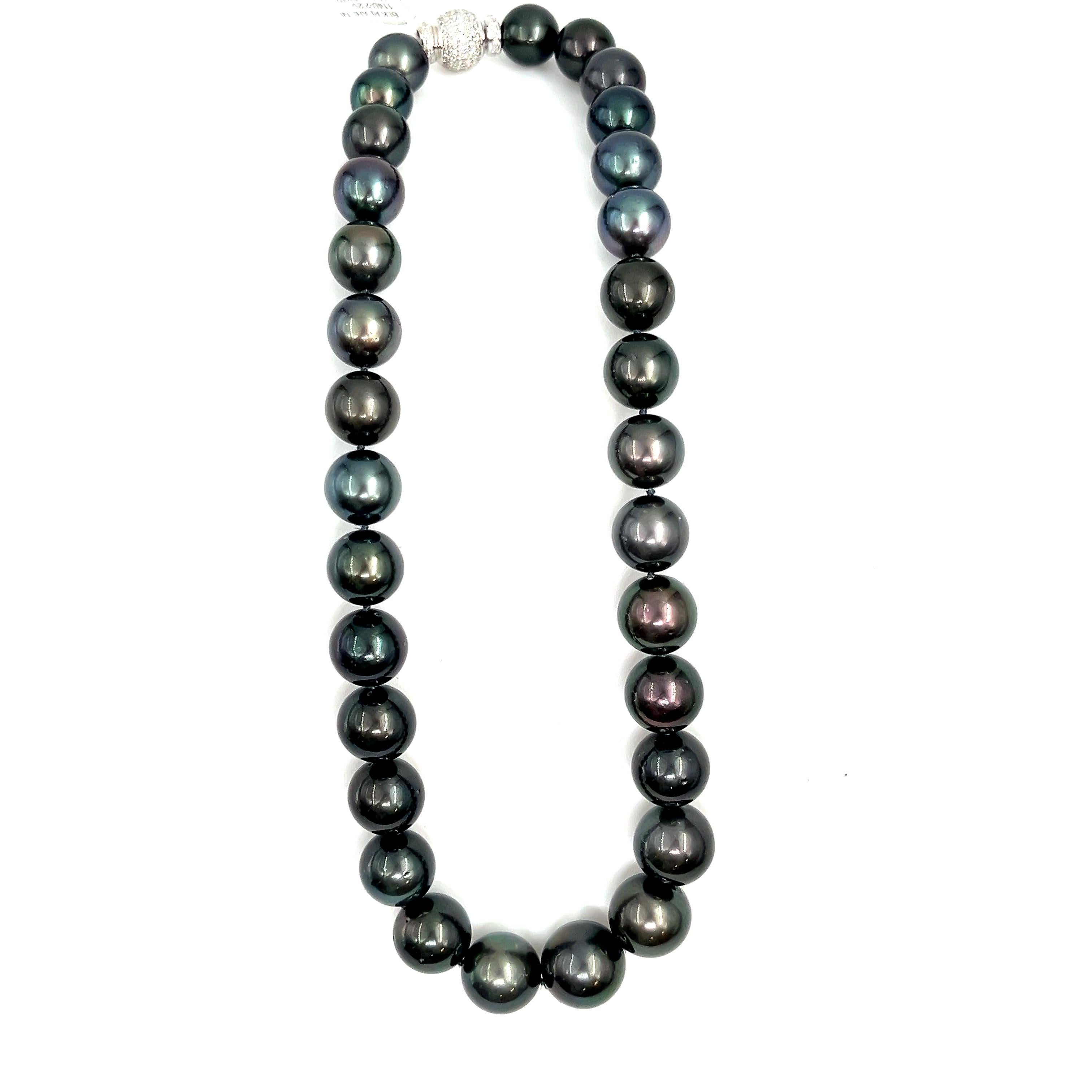 This beautiful black Tahitian pearl necklace ranges from 12 mm to 16.30 mm. The clasp has 114 round brilliant diamonds  weighing 2.25 ct. The diamonds boast a color of E/F, are VS1 in clarity and are set in 18k white gold. A perfect piece for