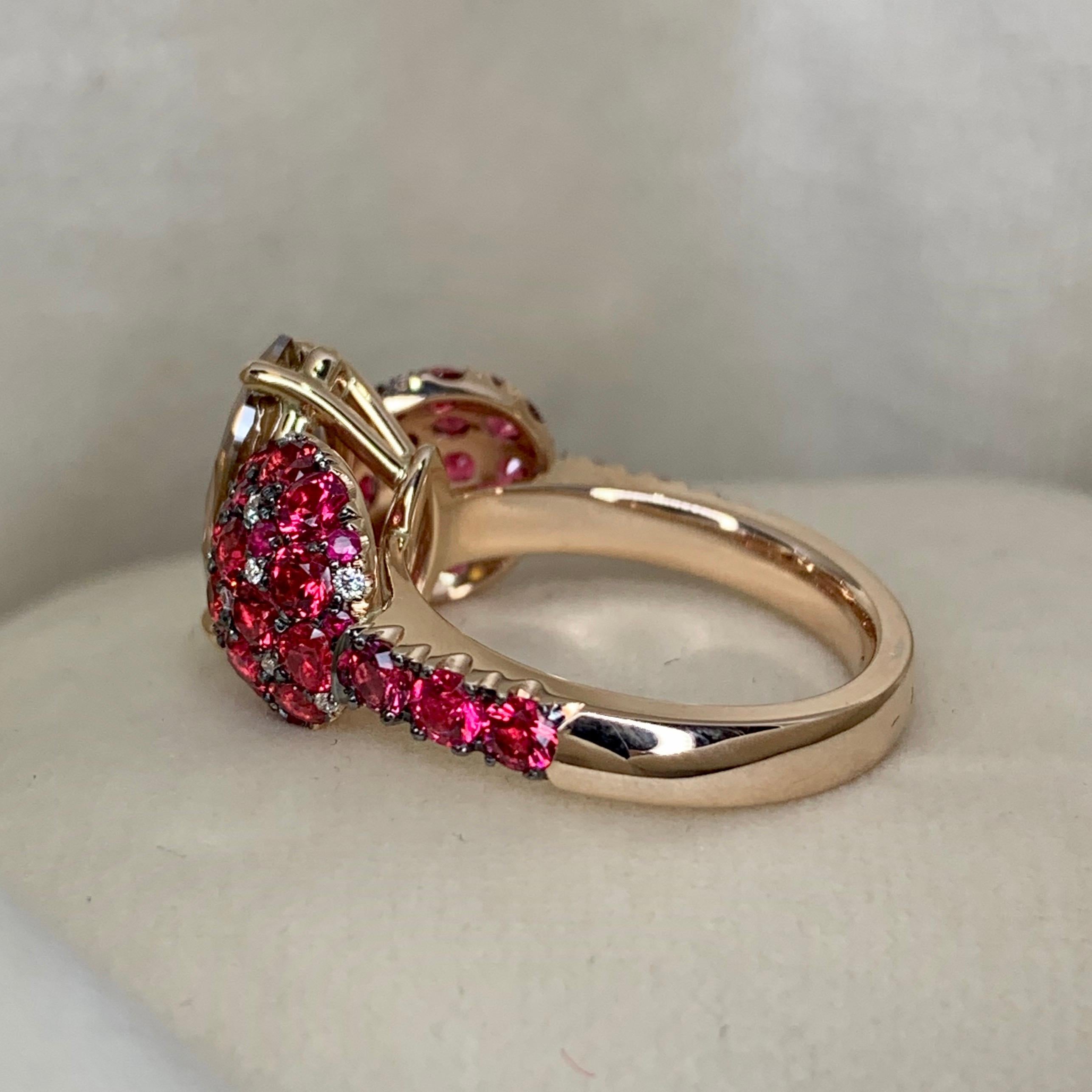 One of a kind ring in 18K Rose gold 7,3 g. Set with a GIA Certified Fancy Deep Orange brown Marquise shape diamond centerstone 2,25ct. VS2, pave set with Unheated poppie red spinel from Mogok, Burma: 2,59ct., white brilliant-cut diamonds 0,1 ct.,